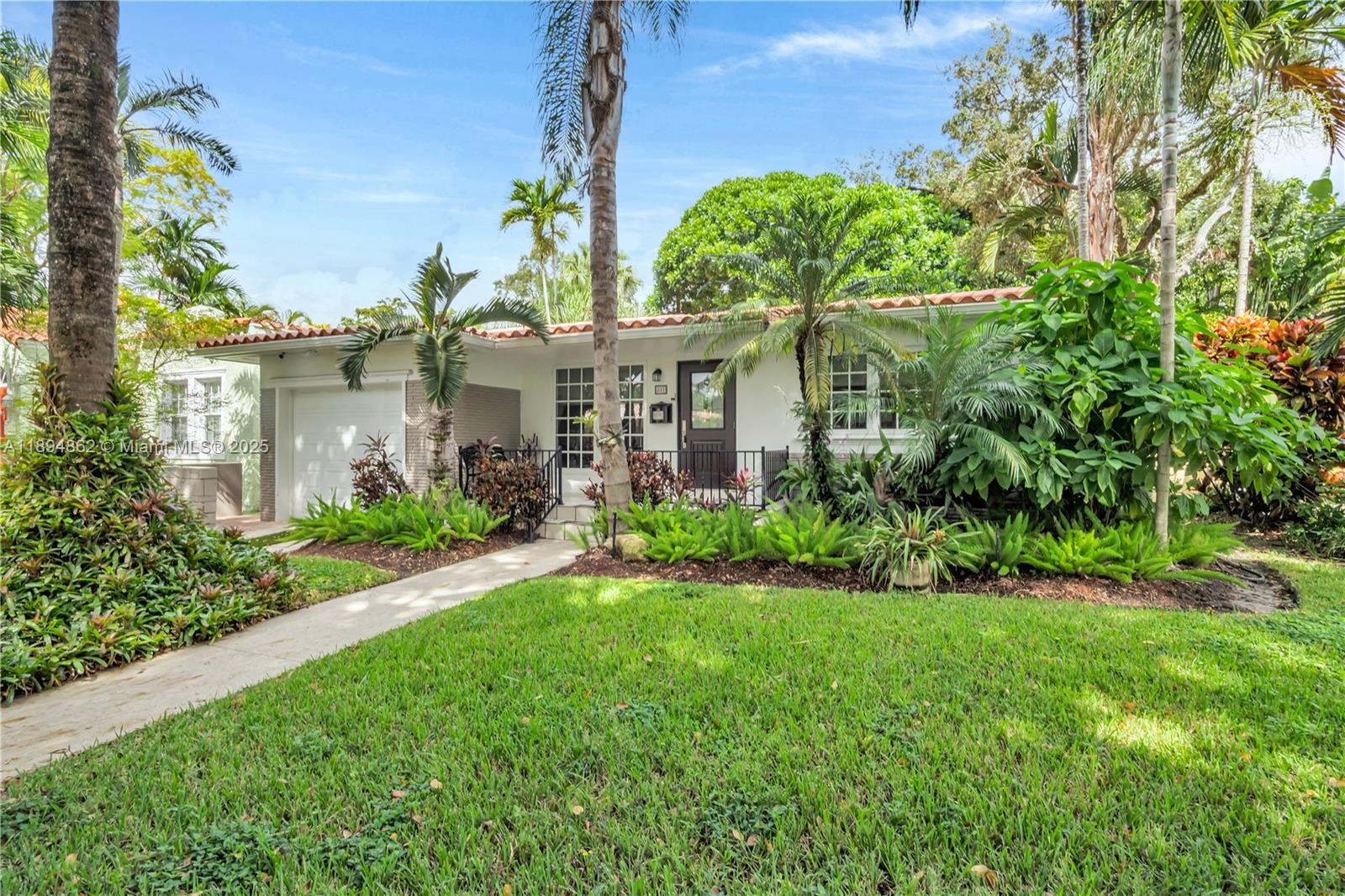 Spacious, bright, and renovated home in a prestigious Coral Gables neighborhood, located a few minutes from Granada Golf Course & several neighborhood little parks. Spacious living, dinning & family room. Large bedroom suites, both with renovated bathrooms. The home features a renovated kitchen (2021) with granite countertops, stainless steel appliances & ceiling height cabinetry. Updated electrical & plumbing (both 2019), original wood, terrazzo floors, & impact windows. The home is set up to support a whole house Generac generator (2020). New air conditioning (2023), AC ducts (2024), insulation (2024), 14 yr roof. A lovely backyard terrace with a built-in Summer kitchen (2022), room for a pool & more, round out the impressive list of features. This is the home you have been waiting for!