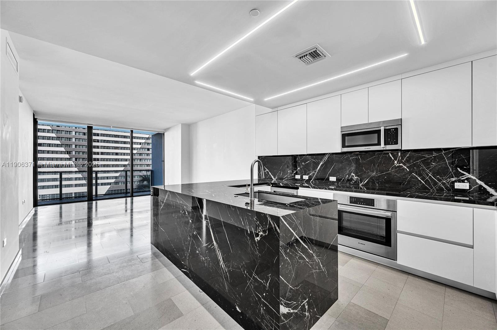 Experience sophisticated city living at Rise Brickell City Centre. This exquisite residence showcases upgraded designer lighting, custom-built Italian closets and doors, and a remodeled, expanded kitchen with elegant premium countertops. Every detail reflects a European flow and touch, crafted with high-end finishes and timeless design. A perfect blend of modern comfort and refined elegance in the heart of Brickell.