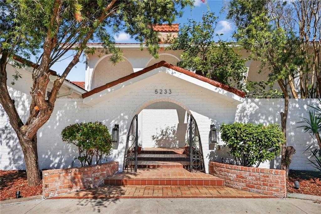 OPEN House, Sunday November 2nd 12pm-2pm! Welcome to 5233 Cleveland Place, a Captivating Spanish-Style Levee-Front Estate. This Metairie Oasis is Situated in Country Club Estates, a highly desirable X Flood Zone. Step into a private courtyard entrance and discover this unique Entertainers Paradise. Featuring high ceilings and Terracotta Flooring. This 4 bedroom, 3 bath home featuring an Exquisite Downstairs Primary Suite, is also Equipped with a Whole House Generator for Extra Peace of Mind. The well-appointed Kitchen features Premium Appliances including a Sub-Zero Refrigerator, Bosch Double Oven, and a Brand New Reverse Osmosis System. The Second Floor offers an Expansive Entertainment Space with a Wet Bar, perfect for Entertaining or Relaxing. This Space boasts Direct Access to the upstairs Balcony & Patio offering Breathtaking Views. Backyard features a Serene setting with a Beautiful Patio and Salt Water Pool with new pump & heater. A Separate Pool house offers incredible versatility as a Private Guest Suite, dedicated Workout Area, or Cabana with lots of Natural Light and a Private Bath with Huge shower. This Luxurious Home also offers Rear Yard Access with Dedicated Parking for a Boat or RV, plus an additional Circular Driveway for added Convenience. Enjoy exclusive living with 100 Feet of Levee Frontage and your Very Own Private Access, Ideal for Walking, Jogging, or Biking- True Haven for an Active Outdoor Lifestyle. This Home is Truly a Rare Find!