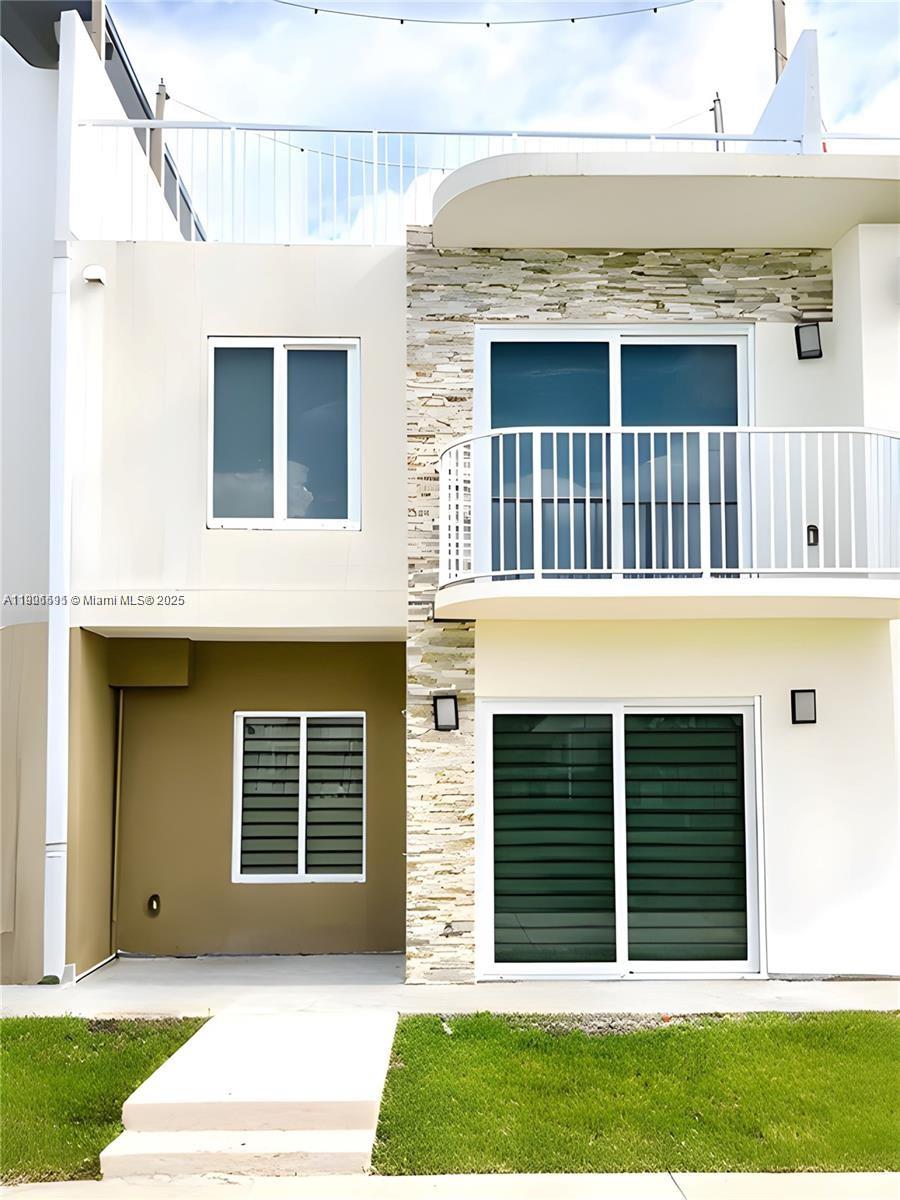 Stunning 4-bedroom, 3.5-bath townhome, designed for both comfort and style. Built in 2021, this energy-efficient home features high-impact windows and doors, allowing natural light to enhance its porcelain tile floors and refined textured walls. Luxury Finishes & Thoughtful Design The layout includes a private in-law suite on the ground floor with its own entrance, offering flexible living options. The shower features sleek tempered glass doors with stainless steel frames. The modern kitchen boasts brand-new stainless steel appliances, while the primary suite features a walk-in closet and a spa-like ensuite bath, creating a serene retreat. Entertainment & Convenience Enjoy breathtaking views from your private rooftop terrace, ideal for outdoor gatherings. LOW HOA