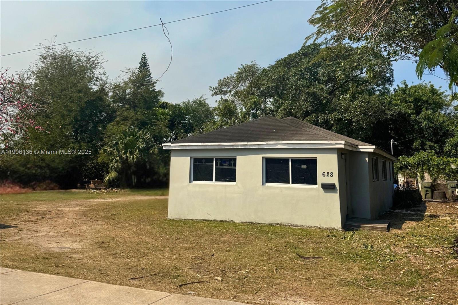Priced to Sell! Charming single-family home on an oversized 10,000 SQFT corner lot in a quiet residential pocket of Homestead. Features an updated white kitchen, tile flooring, and a spacious layout with room to expand or add value. Sale includes adjacent land parcel (Folio 10-7813-004-0780)—a rare opportunity for additional storage, parking, or future development. Located just minutes from Downtown Homestead, parks, shopping, and major roadways. City streets on both sides offer excellent access and privacy. No HOA. Great option for homeowners, investors, or builders! Currently rented at $2100 a month.