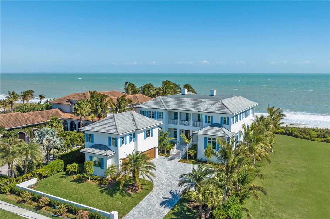 Just completed! Discover an extraordinary new oceanfront home in Vero's prestigious seaside downtown, where luxury & coastal elegance converge. Spanning 100’ along the ocean, this residence offers 7,657± AC SF w/ impeccable finishes & a clean transitional design. Features include 2 primary suites, 3 guest bedrooms, owner's retreat, elevator, wine room, beachfront lanai w/ pool/spa, private beach access plus guest house atop the 3-car garage, complete w/ kitchen & living area. Enjoy the convenience of Central Beach w/ shopping, fine dining & entertainment options steps away. Adj. Lot Available.