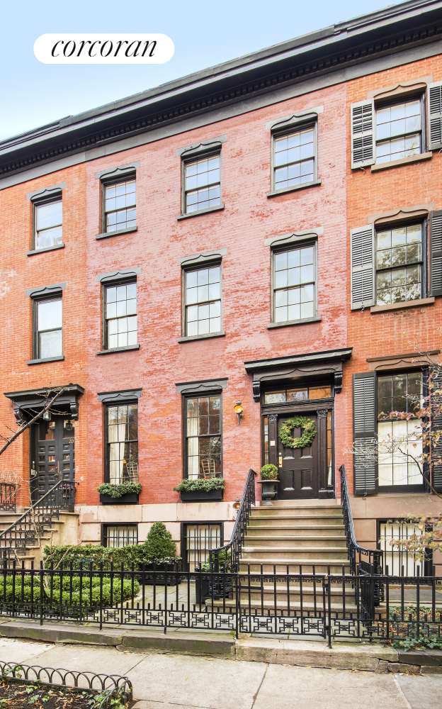 On Bank Street which is a quintessential Greenwich Village Street named for the Bank of New York, founded by Alexander Hamilton sits this charming townhouse has just undergone a triple-mint renovation by the architect G.P. Schafer.  Built between 1844-1845, 22 Bank Street is a single-family townhouse with a red brick facade that sits in the middle of this quiet tree-lined block. The house is 19 feet wide with a 42 foot South-facing garden.  On entering the Parlor level from the original stoop you are greeted by great room of impressive scale, spanning 38' with 11' ceilings. This room features two fireplaces and beautiful built-in bookcases. The original window shutters have been restored and open  to allow sunlight to flood in. At the far end of the great room is a library with over-sized windows and a Juliet balcony overlooking the garden below. A powder room is conveniently located on this floor. There is a brand new interior elevator serving all  of the upper floors.  Entering the house from the garden-level door you are greeted by a perfectly appointed entryway with built-in bench and coat rack. Just off the hallway is a den that could also function as a guest suite if needed. Through to the back of the house you will find  a formal dining room centered on a gas fireplace. This room opens up into a gleaming chef's kitchen centered on a large marble island. The kitchen features top-of-the line appliances including two dishwashers and a sizeable pantry with wine storage. The kitchen  looks out onto the bamboo planted garden. This south-facing garden is the perfect oasis offering privacy and quiet while still getting wonderful light.  The renovation has thoughtfully preserved historic details throughout, including the original staircase. On the second floor of the house are two spacious bedroom suites. The front room looks out onto Bank Street and has a walk-in closet and ensuite bathroom.  The back room features an ensuite bathroom and a wall of glass-paned doors onto a large terrace overlooking the garden.  The top floor is a luxurious Primary bedroom suite. The dressing room is complete with built-in closets and natural light. It also gives access to a sizeable terrace with views over townhouse gardens. The Primary bedroom is centered on a decorative fireplace  and three large windows that look out onto the beautiful, charming, tree-lined Bank Street while letting in enormous amounts of light with northern exposure. The primary bathroom contains double sinks, marble counter tops, a soaking tub and separate standing  shower under a large skylight.   The cellar is the perfect place for a home gym or yoga studio. It is lined with storage and has a powder room as well as the laundry facilities for the house. The flooring throughout the house is reclaimed pine evoking the age when the house was built. The  house strikes the perfect chord between modern sensibilities and the beautiful history within its walls.