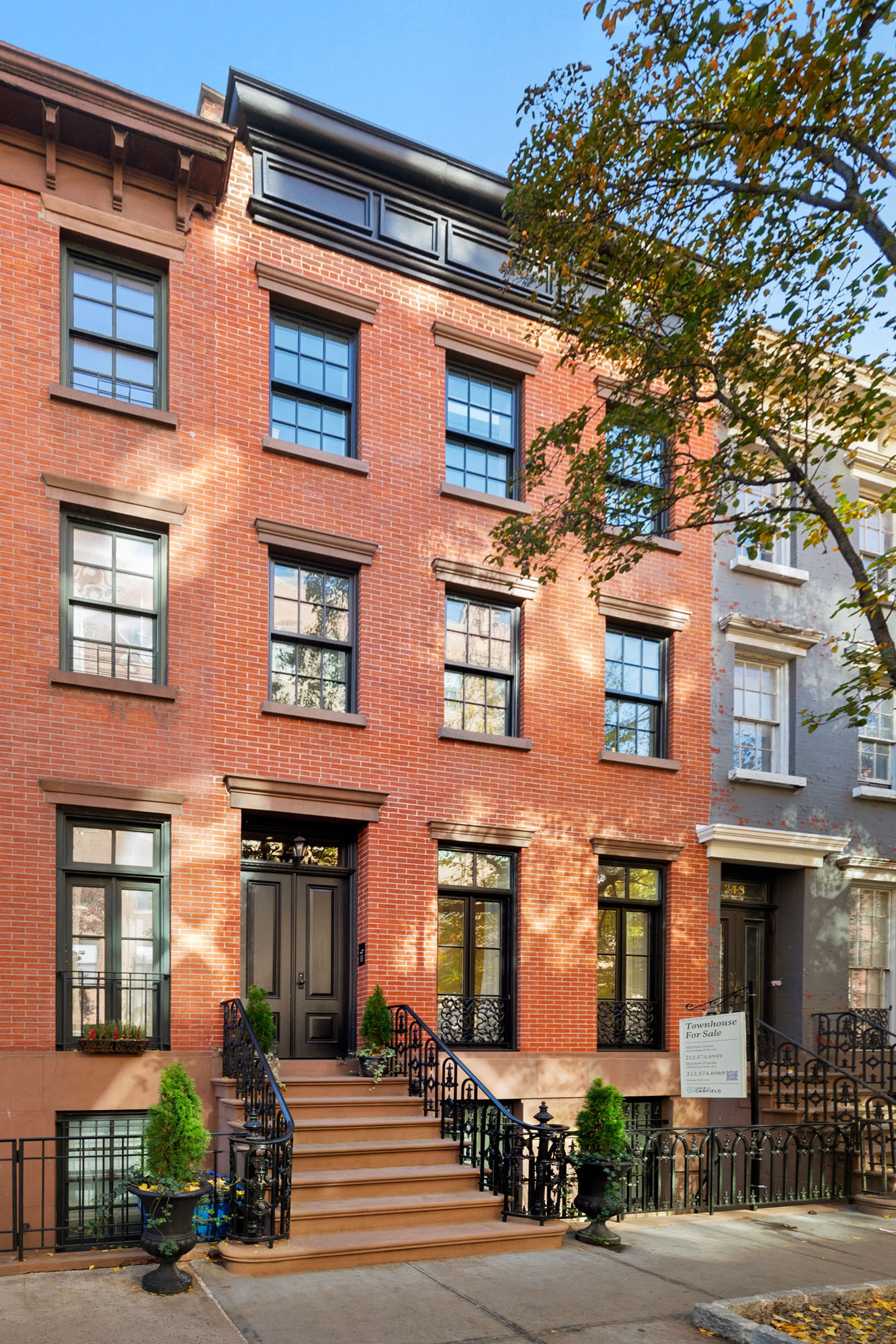 **Timeless Elegance at 246 West 12th Street, West Village**  

Experience the perfect fusion of historic charm and modern luxury at 246 West 12th Street, a meticulously renovated 19th-century Greek Revival townhome in Manhattan’s West Village. Spanning five levels, this residence offers approximately 5,100 square feet of interior space and 1,520 square feet of private outdoor areas.  

Features include radiant floor heating, a multi-zoned electric snowmelt system, and a Savant smart home system. The English Basement, with 9-foot ceilings and a private entrance, includes a flexible room for a guest suite or office. The custom kitchen features Italian Arclinea cabinetry, Calacatta Borghini marble, and Sub Zero and Miele appliances, framed by a striking double-height black steel window wall overlooking a serene south-facing garden with an outdoor kitchenette and gas barbecue.  

The Parlor level combines classic design with modern sophistication, showcasing a marble foyer, oak floors, a statuary marble fireplace, and a dining area with a Poliform serving console, a dry bar, and a double-height window wall offering garden views.  

The third floor features a spacious south-facing bedroom with a grand terrace, a Poliform dressing closet, and a Bianco Dolomiti marble bathroom with a soaking tub, steam shower, and double vanity. The fourth floor includes three bright bedrooms, skylights, and a rooftop deck with ipe wood fencing and a kitchenette with a refrigerator and ice maker.  

The cellar level, with nearly 14-foot ceilings achieved through underpinning and excavation, includes a walkable skylight, a 700-bottle wine room, a multipurpose room, a bathroom, a laundry area, and ample storage, perfect for a home theater, gym, or guest accommodations.  

Located steps from the Hudson River Park, High Line, Whitney Museum, and renowned dining and shopping, 246 West 12th Street is an exceptional residence in the heart of the West Village.