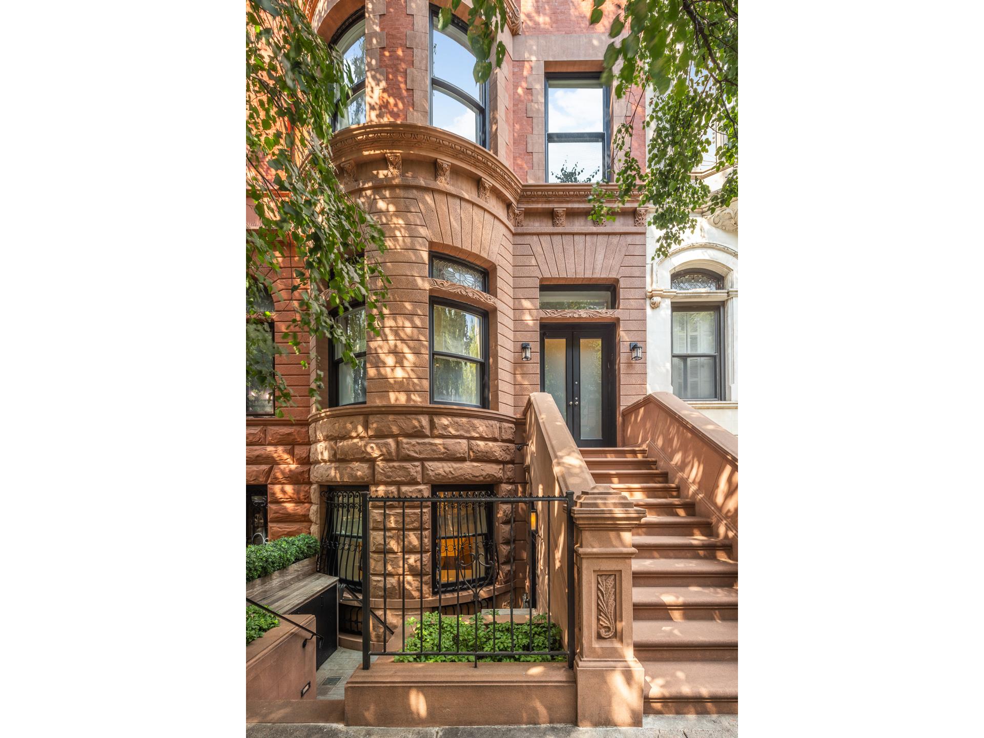 Situated on an Upper West Side pristine park block with many single-family homes. This fully restored and renovated six-story 20' wide townhouse has it all.  Approximately 8,000 sq. ft. interior, including excavated cellar and top floor addition with 1,000 sq. ft. of exterior space. Beautiful sunny landscaped garden, 2 terraces and south and north facing landscaped roof deck. This savant smart home has soaring ceilings, an alarm system, a wine cellar, 2 working gas fireplaces and 1 wood burning fireplace, 7 zone HVAC, and spectacular  full-width Bliss Knorr Steel and Glass windows in the rear, allowing amazing amounts of light to pour in. And elevator access on every floor. The house was designed by Steven Harris and Chlodagh and was renovated to perfection. Originally built in 1900 and now fully renovated and outfitted for sophisticated and modern living. Floor One/Cellar: Excavated cellar with large rec room with skylight, glass-walled temp-controlled wine room or Gym, laundry, storage, and mechanical rooms. Elevator access. Ceiling Height 8'10". Floor Two/Garden: Enter below the stoop into a bright mudroom with a wall of storage; there is a large formal dining room with a bay window and a chef's Kitchen with top-of-the-line appliances and a large center island-breakfast area, and den with full glass  wall which leads you to the sunny landscaped and irrigated Garden. Additionally, there is a butler's pantry, elevator access, and powder room. Ceiling height 9'. Floor Three/ Parlor: Gracious formal living room with soaring ceilings. The north-facing living room is centered on the modern fireplace and has a full glass wall leading to the terrace overlooking lush gardens. The front parlor also centered on a Gas fireplace  and beautiful built in's includes the main house entrance. Additionally, there is an elevator access and a powder room. Ceiling height 11'7". Floor Four: Spectacular primary bedroom suite. The bedroom in the rear overlooks landscaped gardens, and the dual primary bathrooms are connected through a large walk-through shower, walk-in closets, a dressing area, and beautiful built-ins. The south-facing  library (or additional bedroom) includes an en-suite bathroom, bright southern exposures, closets, and built-ins. Additionally, there is Elevator access. Ceiling height 11'. Floor Five: Two large bedrooms, including a sun-flooded south-facing bedroom with en suite bathroom, closet, and built-ins. Sunny north-facing bedroom with en suite bathroom and 2 closets, built-ins, and a large terrace. This floor includes a laundry room  and elevator access. Ceiling height 10'3".  Floor Six: Two bedrooms, including the south-facing sunny bedroom with en suite bathroom, 2 closets, and built-ins. The north-facing sunny bedroom has two closets, including a large walk-in. Additionally there is a kitchenette, powder room and Elevator access.  Ceiling height 10'. Floor Seven: Loft-like glass solarium with fabulous south and north-facing landscaped roof decks. Built-in Murphy beds, bathroom, walk-in closet, and elevator access. Ceiling height 8'5".