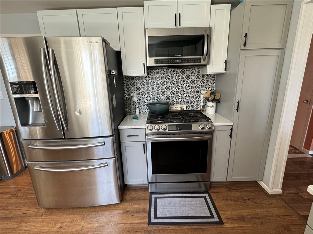 Beautiful young stainless kitchen appliances will