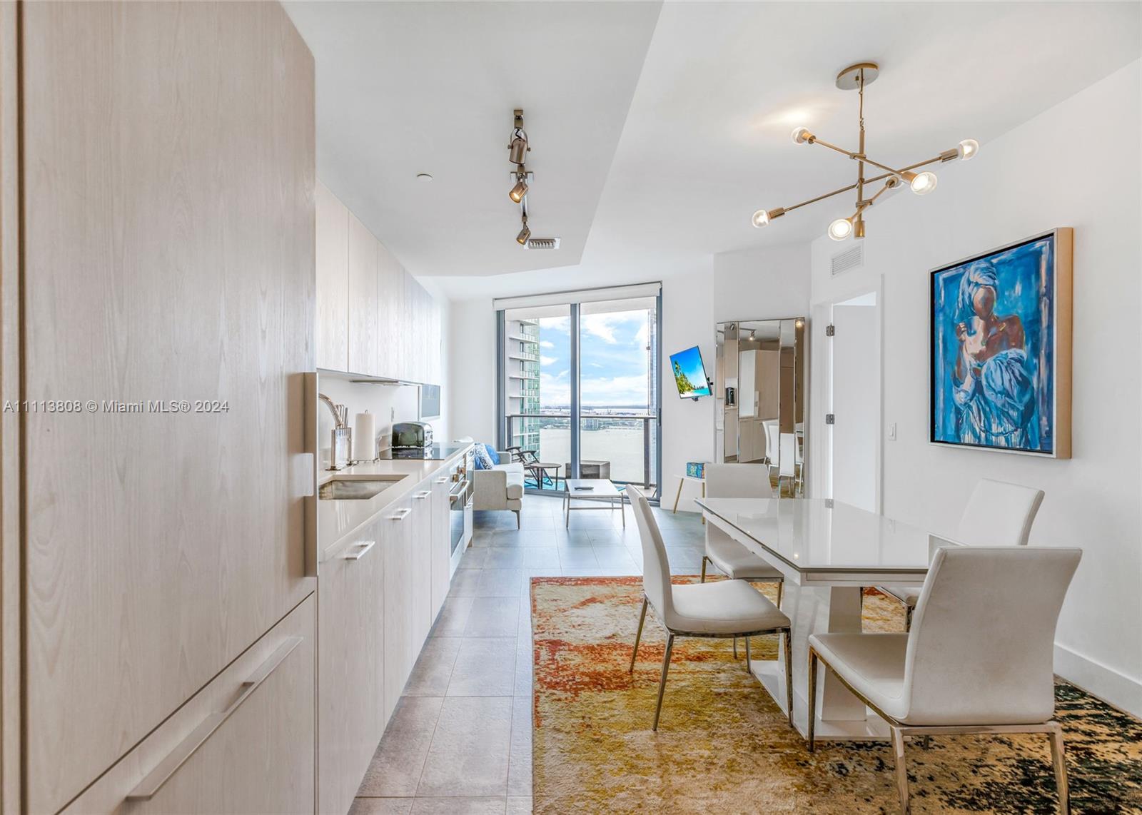 This upscale 1-bedroom plus den condo in trendy Edgewater offers stylish, fully furnished living with stunning Downtown and Miami Beach views. Enjoy premium features like porcelain floors, top-tier appliances, and walking distance to Publix, Trader Joe's, the Design District, restaurants, and more. Building amenities include a 24/7 front desk, tennis court, gym, sauna, 2 pools, BBQ area, jacuzzi, valet, social room, game room, and theater.