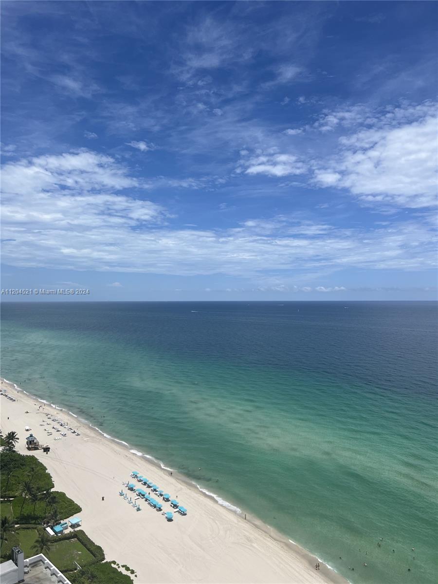 In the heart of Sunny Isles, enjoy resort-style living in large 2 bed/2.5 bath plus den upgraded unit with desirable panoramic north-east view of the ocean, intracoastal & city from 2 terraces. Open-style kitchen, marble floors throughout, floor-to-ceiling windows, fully furnished, tastefully decorated & equipped w/household items. Resort-style amenities include beach, pool service with lounges, umbrellas & towels, fitness center, jacuzzi, pool cabanas, concierge, valet parking, kids room, business lounge, 24 hours security. Steps away from fishing pier. Walking distance to all shops, restaurants, entertainment & public transportation. Min. to Aventura Mall, Gulfstream Casino, Bal Harbor Shops. Available from 10/24-12/15/2024. Rate for short term may vary.  STR-01450. Easy to show.