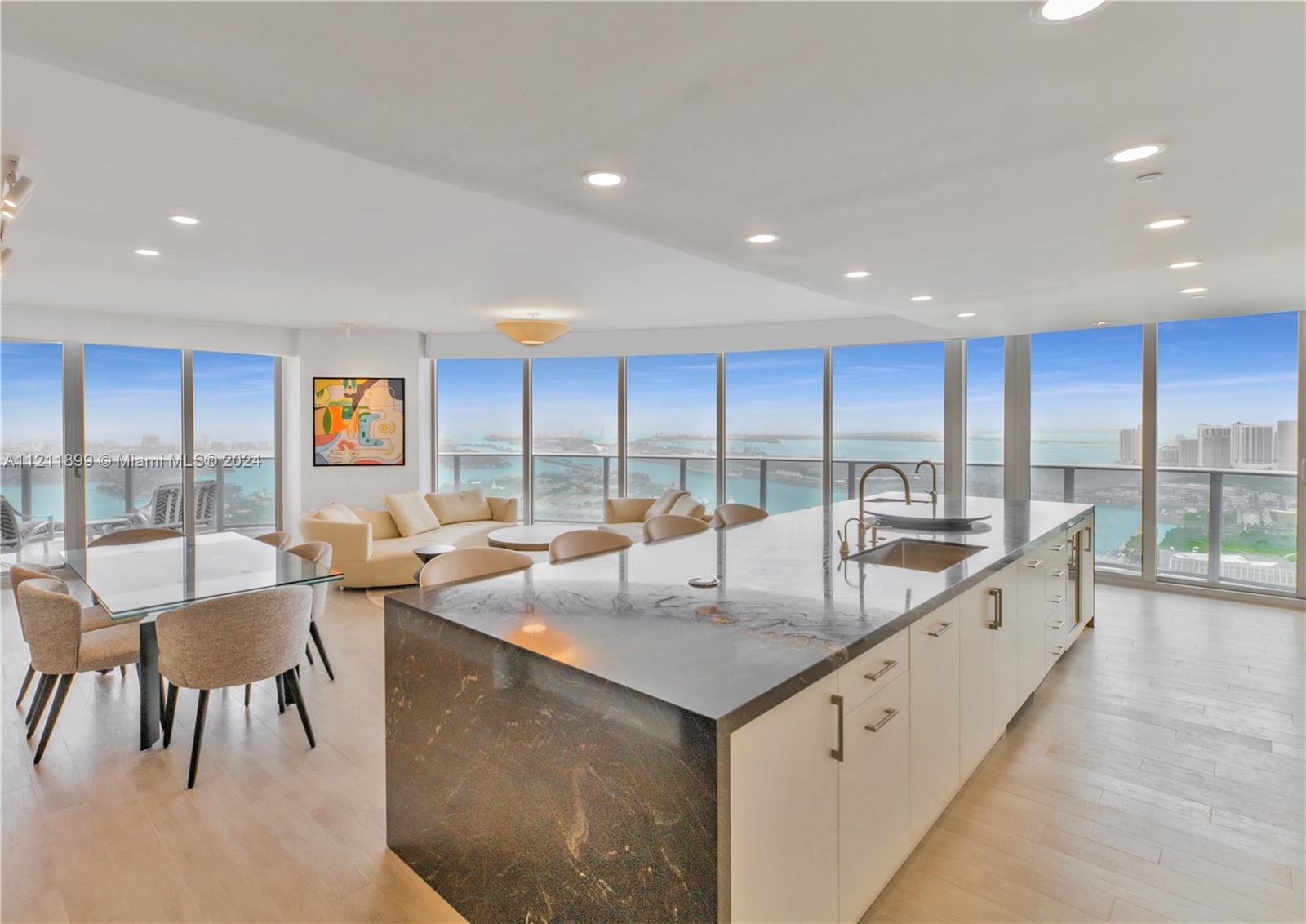 Own Miami's finest, unobstructed views—guaranteed to stay that way as the city grows! This 3 Bed + Den, 4 Bath residence features 2,365 Sq.Ft. of meticulously upgraded interiors (per developer floorplan). Far beyond standard developer units, every finish exudes luxury. 

Panoramic views of Miami Beach, Biscayne Bay, Brickell, and Downtown Miami.  No expense spared, no detail overlooked! Upgrades include: LUALDI ITALIAN DOORS by Piero Lissoni. Custom built kitchen (not developer's), mini-bar area, Sub-Zero refrigerator and freezer drawers, 2 Sub-Zero wine coolers. Wired-in electric window treatments, California closets, Master Bath: custom vanity, Paris Mirrors with LED lighting, TOTO NEOREST Toilets. High-End Furniture negotiable: Roche Bobois, Minotti and more.