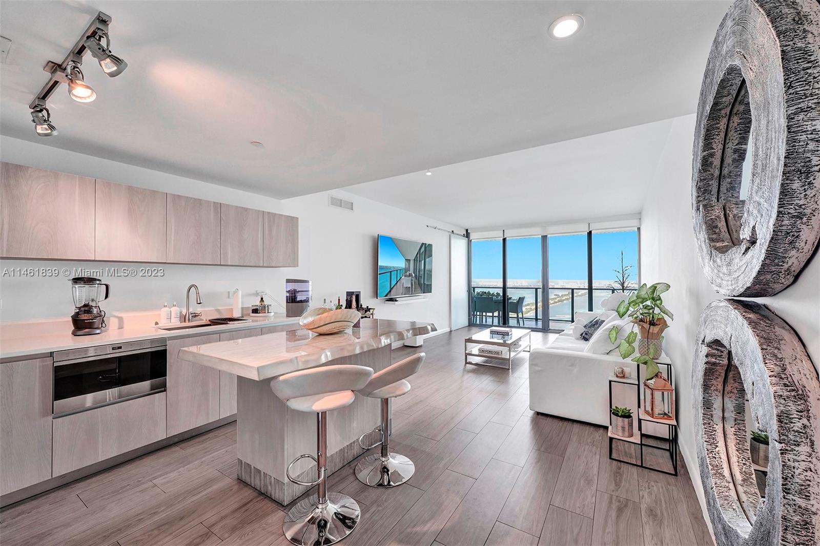 This gorgeous 47th floor 3 bdrm/3.5 bath with den condo has one of the best views Miami has to offer! It has breathtaking, multi-million-dollar views of the Biscayne Bay & Miami Beach skyline. This is available for Investors only as unit is rented until 1/15/25 for $8160/month and does not have a kick out clause.  This AMAZING condo features its own foyer with semi-private elevator access, European cabinetry, Sub-Zero & Wolf appliances, floor to ceiling windows, 2 private balconies, porcelain tile throughout with marble in the bathrooms, custom closets & custom window treatments & much more.  One Paraiso has resort-like amenities which include 2 Olympic size pools, hot tub, state of the art fitness center, spinning room, yoga room, party room, business center, kid's playroom, game room.