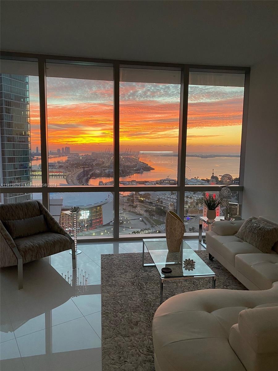 $1,299,000 unfurnished or $1,325,000 furnished w/ 100k in DESIGNER FURNISHINGS, Both Prices include a LARGE STORAGE UNIT ON THE SECOND FLOOR.  Stunning Ocean and Skyline views! Move right in-decorator furnishings negotiable! Garage parking + 2 valet spaces. Considered one of the most amenity-rich buildings in the world, this 29th floor condo features luxurious finishes, and floor to ceiling windows. Elevator opens to your private foyer, split bedrooms with ensuite baths plus guest bath. Quartz waterfall kitchen island, Bosch & Subzero, Italian cabinetry. Generous master suite w/spa-like bathroom; soaking tub and walk-in shower. Enjoy the resort style pool w/cabanas, fitness room, movie theater, recording studio, golf simulator, soccer field, indoor basketball, multiple rooftop pools.