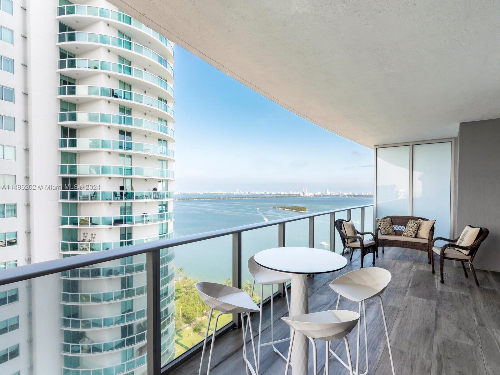 Stunning 2 Bedrooms + Den with 3 full bathrooms, private foyer, and a wraparound balcony offering breathtaking bay views from the 21st floor. This 1,366 sq ft (127 sqm) unit features a 325 sq ft (30 sqm) balcony, totaling 1,691 sq ft (157 sqm) of luxury living space. Enjoy spacious bedrooms with walk-in closets, an Italian kitchen with top-tier appliances, and a private elevator. The building offers 5-star amenities, including 2 pools, a spa, sauna, steam room, yoga studio, gym, kids' playroom, BBQ area, business center, and concierge. Prime location minutes from Arsht Center, South Beach, Wynwood, and MIA Airport.