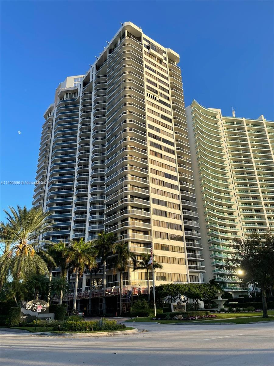 2-bed, 2-bath apartment with picturesque golf and water views, patiently awaiting a new owner to infuse their personal style through a remodel.