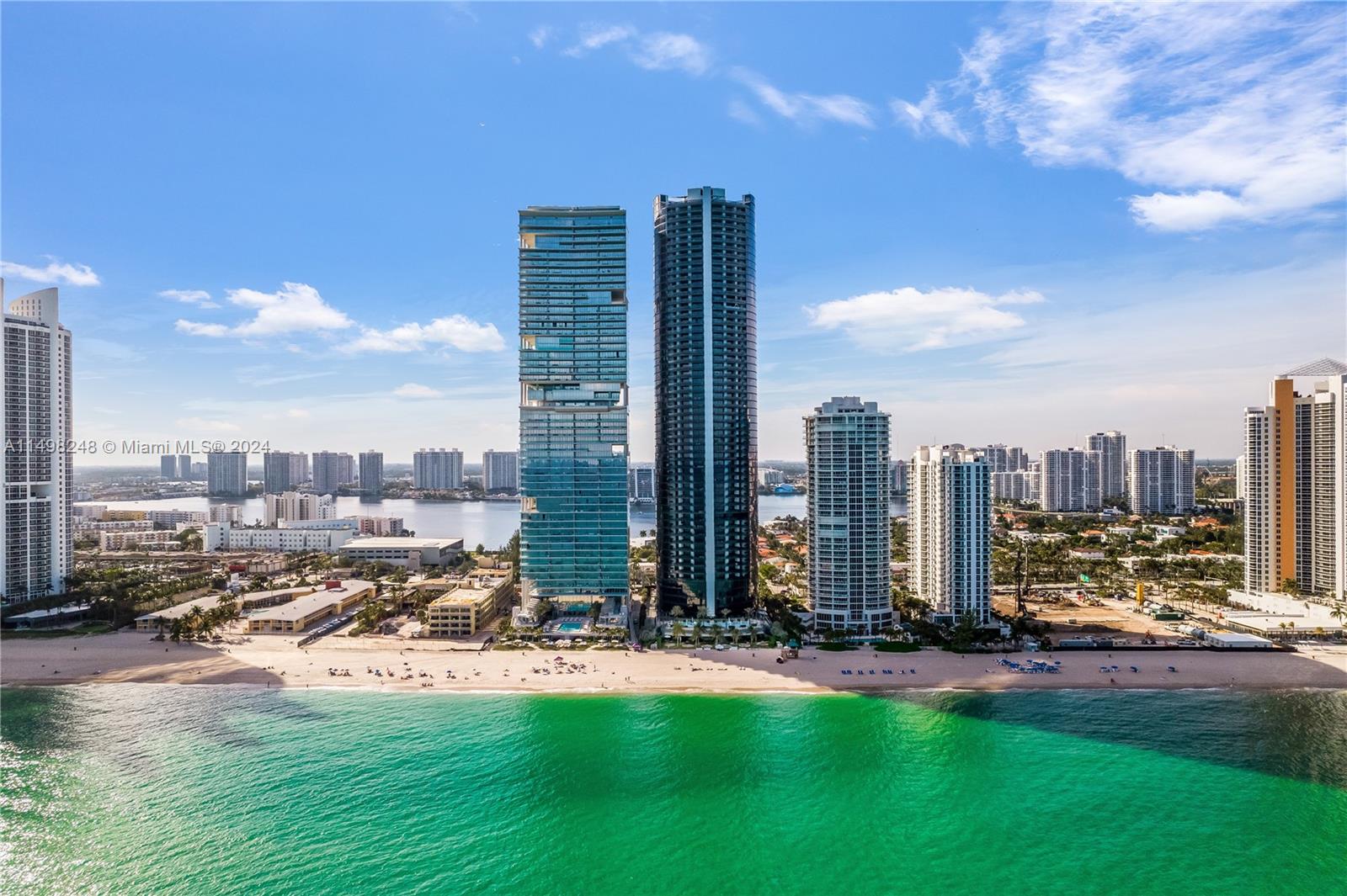 Nestled within the prestigious Porsche Tower in Sunny Isles Beach, unit 1503 offers a luxurious sanctuary with breathtaking vistas. This opulent residence presents a panoramic spectacle of the glamorous bay and the dazzling Miami skyline and an astonishing sunset. Boasting four bedrooms and four and a half baths, the expansive 3,555 square feet of living space is adorned with sophisticated, high-end furnishings, creating an ambiance of refined elegance. 

The unit`s design seamlessly blends modern aesthetics with comfort, providing a stylish retreat that complements the striking views beyond its windows. With meticulous attention to detail and an abundance of natural light, this fully furnished residence in Porsche Tower epitomizes upscale living in one of Miami's sought-after locations.