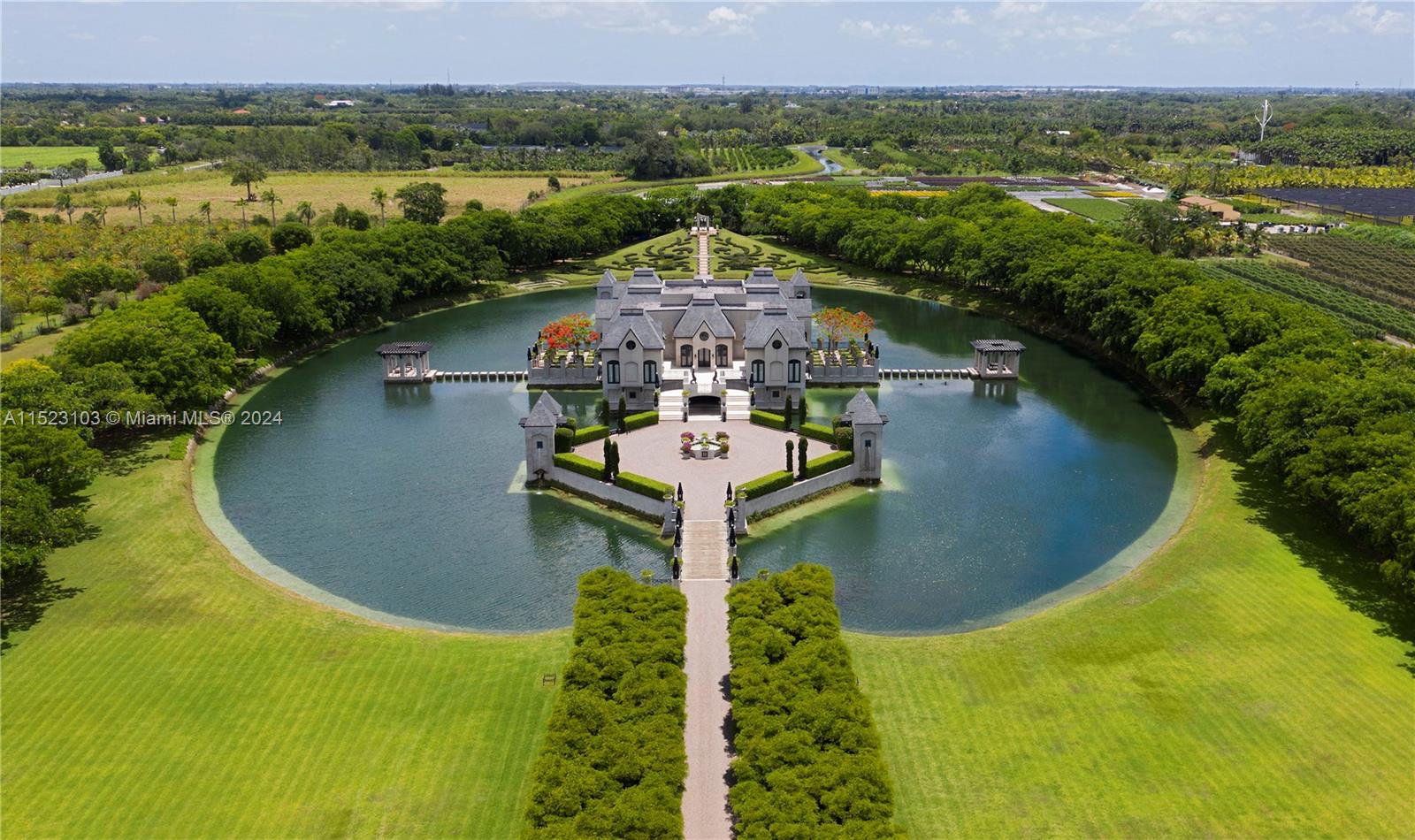 Experience Château Artisan, a masterpiece built/designed by renowned Architect Charles Sieger. Foundation was carved into the coral rock that defines South Florida. This nearly 20,000 sf home (per owner) nestled on 13.74 acres in The Redlands offers privacy, magical views and sophisticated living. Resembling a modern French Château, it features a freshwater lake, manicured gardens, and three levels of luxurious living spaces. The double stair foyer leads to a chef's kitchen, music room, and fireplaces for intimate gatherings. With super yacht-like bedrooms, this unique home is an irreplaceable treasure for a discerning owner.