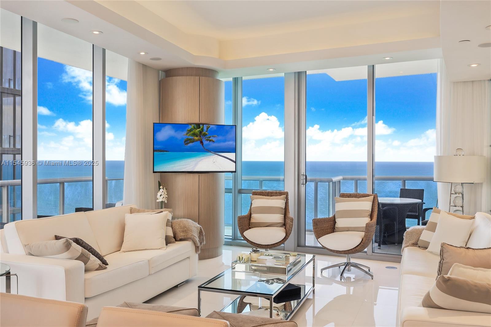 Stunning Corner Unit with Direct Ocean, Bay, and City Views! 3 Beds, 3 Full Baths, 1 Half Bath for Guests, in Sunny Isles Beach's Most Luxurious Building by Architect Carlos Ott! Featured in DECOR Magazine, this unit was Professionally Decorated by INFINITY DESIGN, helmed by Ronny Constansi. Boasting a Spacious 1,956 SF, Vast Terraces, Private Elevator Entry, Breathtaking Floor-To-Ceiling High-Impact Glass Windows, Smart Home Technology, Automated Window Treatments, Surround Sound, Marble Floors, and Top-of-the-Line Appliances. Offered Furnished or Unfurnished. Amenities: Two Edge Infinity Pools, Fitness Center, Private Cinema, Children's Playroom, 24/7 Concierge Services, Private Beach Club, and Spa with Lounge Area. Experience Luxury Living in Sunny Isles Beach's Prime Location!