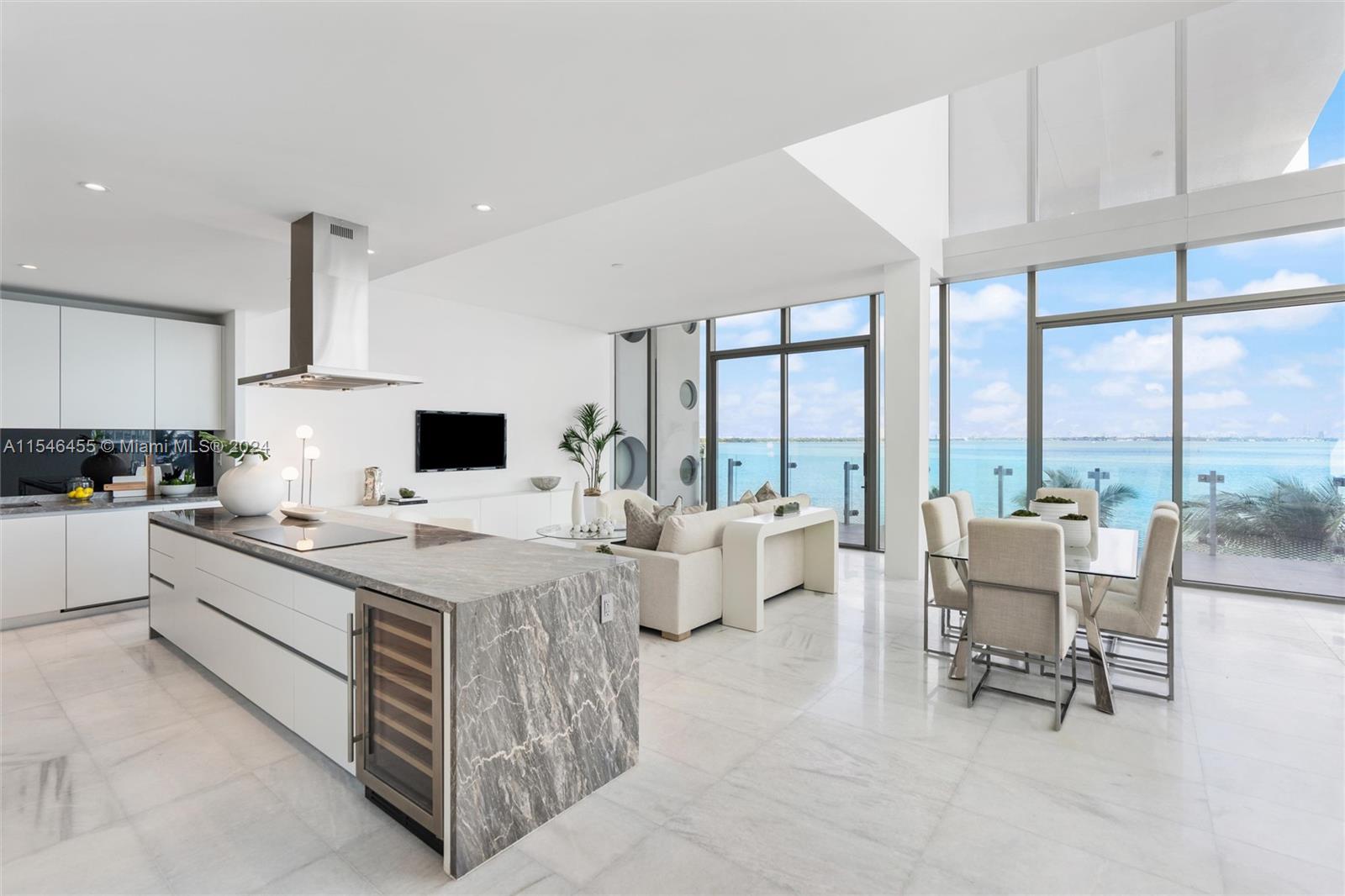 Discover the luxury living at Missoni Baia Residences, in the heart of Miami. This exclusive waterfront property offers a 6-bedroom, 6.5-bathroom, 2-story townhome with breathtaking views of Biscayne Bay. As you step into the foyer, you'll be greeted by stunning marble Calacatta flooring leading to an open floor plan, perfect for entertaining guests. Enjoy the convenience of a private elevator and top-of-the-line appliances in the kitchen. The townhome also features a maid's quarters and laundry for added comfort. Missoni Baia offers various curated amenities designed by fashion brand designers to enhance your lifestyle. Indulge in the spa, lounge by the pool, or play a game of tennis on the court. The nearby Miami Design District offers art, culture, shopping, & dining experiences.