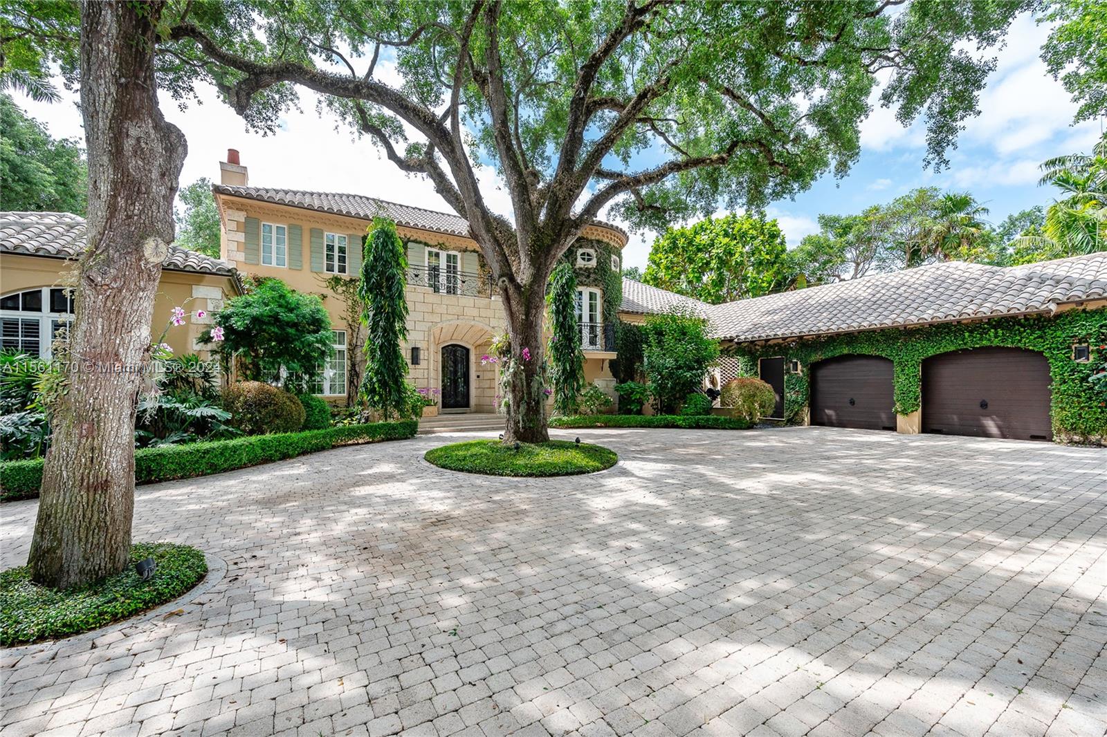 Located in the heart of Coral Gables on a CUL DE SAC behind a private gate, this property offers 7,787 LIV SQFT, 6-bedrooms, 6.5 bathroom, plus a den and a 3 CAR GARAGE. Sitting on a 42,253 SQFT LOT, this property is full of LUSH landscaping full of oak trees. The MASTER SUITE wing is DOWNSTAIRS and also includes a private den ideal for a home office. UPSTAIRS, find three bedrooms, each with terrace access and ensuite. Step outside to discover a private paradise; the backyard features a large pool, an outdoor kitchen and bar, an outdoor dining area, and plenty of poolside lounging space. Property includes a separate GUEST HOUSE with a bedroom and full ensuite bathroom. House may be bought with furniture and fixtures for additional consideration.