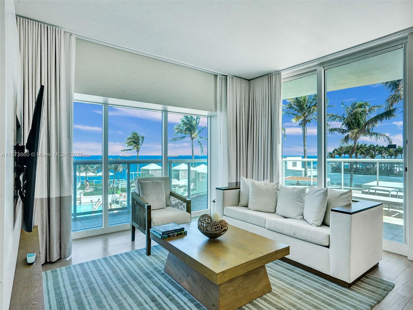 MOTIVATED SELLER! Resort style living! Exclusive oceanfront condo, ONE of just two units in the building, spacious 1 BR , two-bath layout spanning 1028 sqft. Step into your wraparound balcony on the south side with floor-to-ceiling impact windows, tons of natural light. Fully-furnished with luxurious amenities including a king bed, sleeper sofa, full kitchen, washer/dryer, and more. Enjoy 5-star resort-style hotel amenities such as restaurants, bars, room service, fitness center, spa, concierge, and heated pool. Showings scheduled in advance for rentals. LIFESTYLE PROPERTY; perfect for those looking to own an oceanfront condo & share carrying cost. Participate in a revenue-sharing program for hassle-free rental income