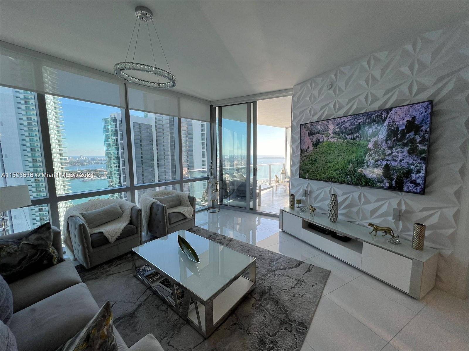 Experience Luxury Living at its finest in this stunning 2 bedroom plus den ,3 bathrooms fully furnished condo at Paramount Miami Worldcenter. Floor-to-ceiling windows and sliding glass doors leading to a spacious balcony with breathtaking City and Ocean views.Gourmet kitchen w/ high end appliances, quartz countertops, custom cabinetry,Master Bed with en-suite bathroom, walk-in closet, and private access to balcony, two additional bedrooms with ample closet space and shared bathroom. World class amenities, with Rooftop pool and sundeck, Fitness center yoga and Spa, box ring, basketball & tennis court, soccer field and much more...
Golf simulator, movie theater, 24/7 security & concierge,