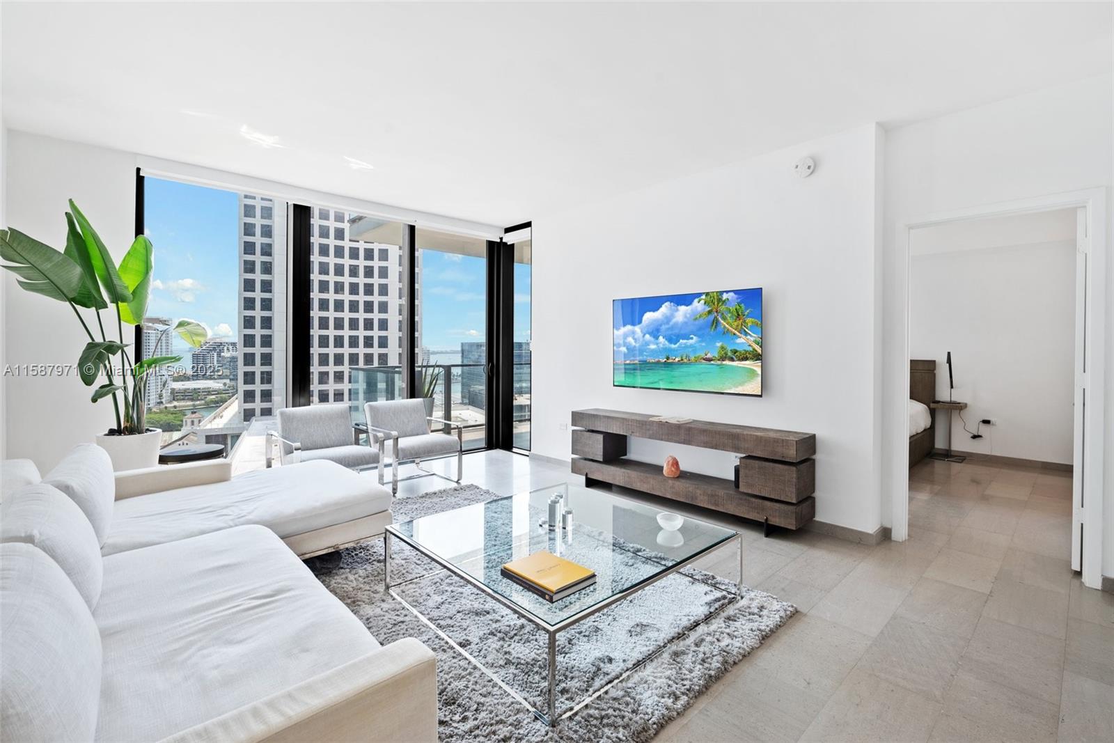 Enjoy living in exclusive Reach at Brickell City Center! Modern spacious 1 bedrooms 1.5 baths unit, large balcony with panoramic city skyline view, 11 feet ceilings, natural stone floors throughout, Italian kitchen cabinets, top of the line appliances, quartz countertops, wine bottle storage, elegant bathrooms with soaking tubs and frameless glass enclosed showers, impact doors and windows. 5 stars building amenities include full gym & SPA, heated pool, Jacuzzis, BBQ area, children play area, business center, 24-hours concierge, valet service.