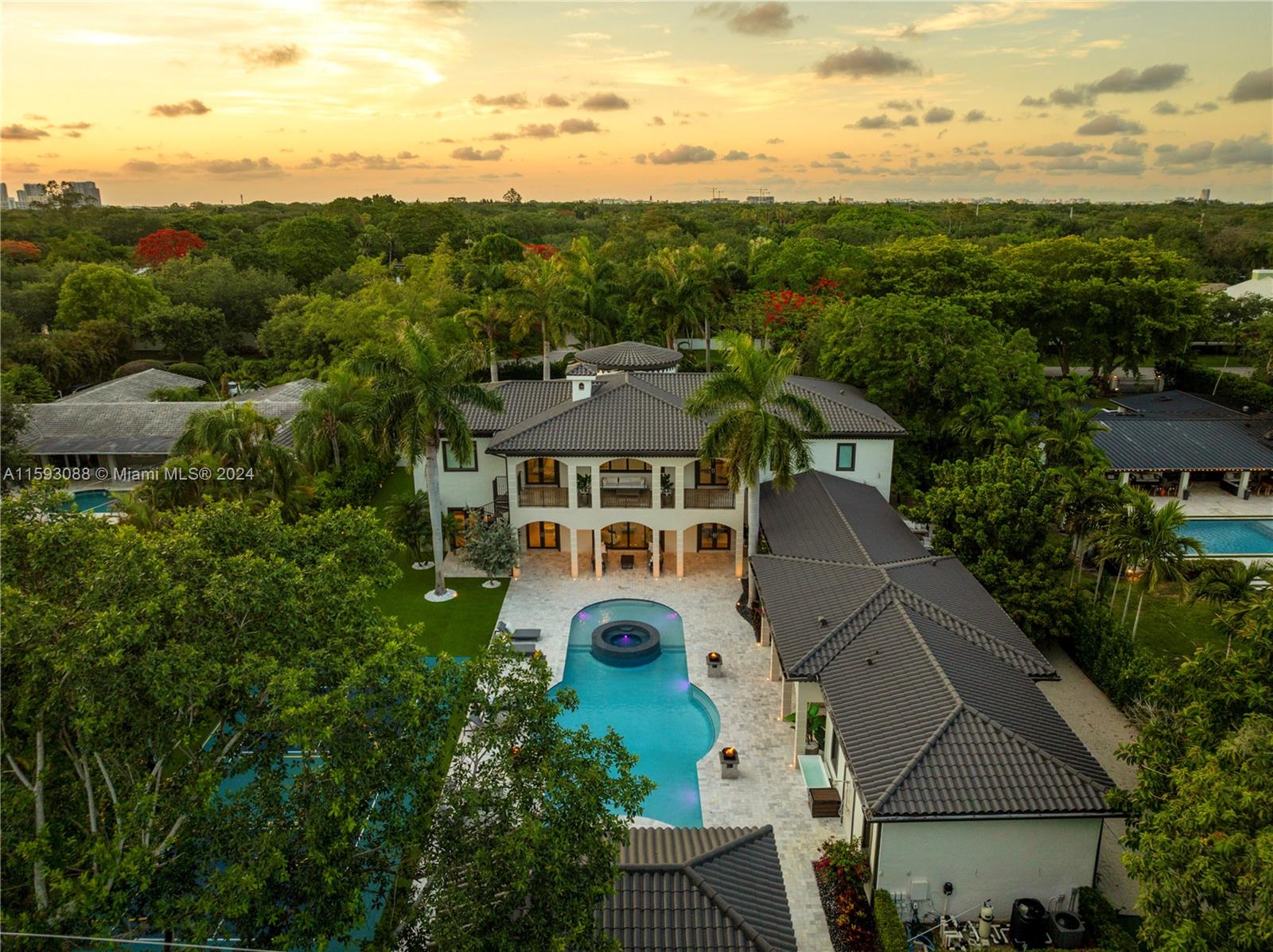 Embrace modern elegance with this fully renovated 7 bed, 8.5 bath estate in Pinecrest. The open-concept living area features a welcoming fireplace, while the formal dining area sets the stage for refined entertaining. The chef's kitchen is adorned with a large L-shaped marble island, perfect for culinary creations.  The ground floor primary bedroom showcases a stunning sitting area entrance, his & her closets, and a spa-like bathroom. Delight in the resort-style amenities, including a sauna, gym, expansive saltwater pool, pickleball/basketball court, jacuzzi, and an invigorating cold plunge. Further enhancing the home with a smart home system, 3 car garage, and a summer kitchen. Close proximity to renowned Pinecrest schools for a seamless integration of sophistication and community living.