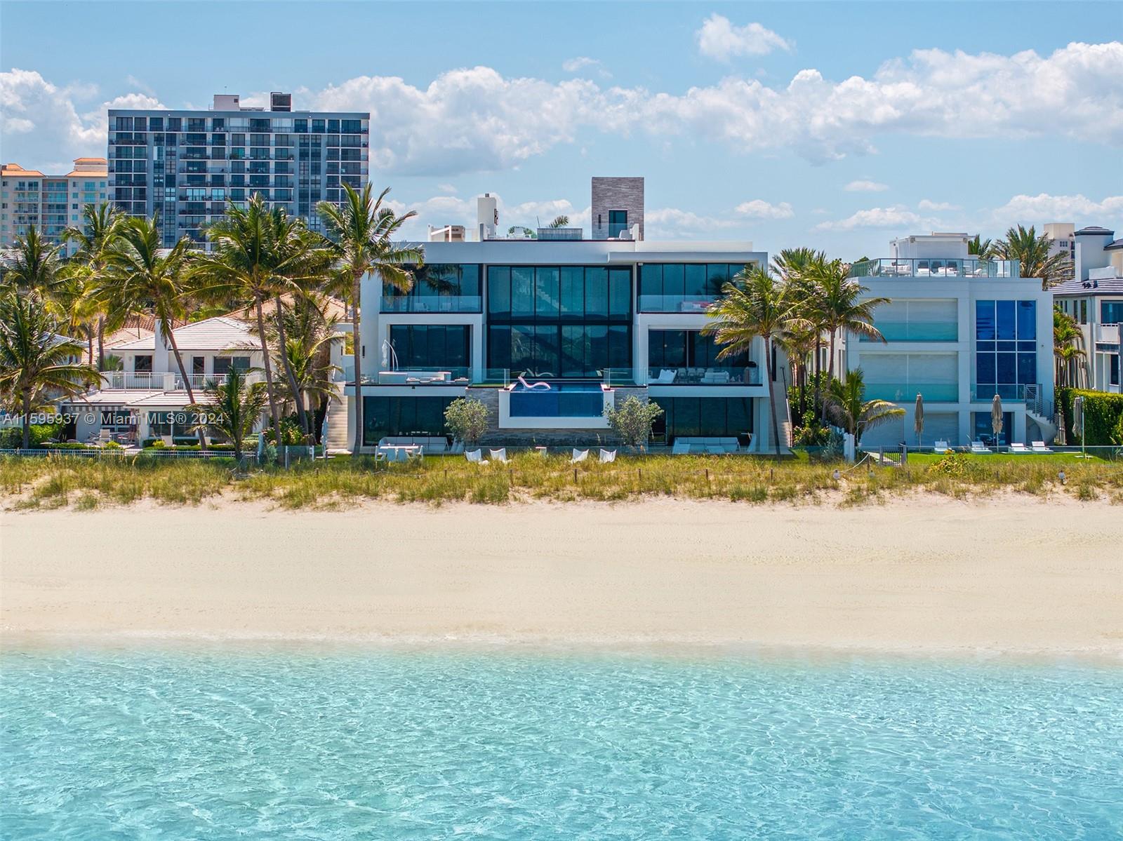 Welcome to Bomar Builders' oceanfront mansion on the famous Ft. Lauderdale beach. This oasis paradise boasts 12,667 square feet and 100' of pristine ocean frontage. Crafted with the finest materials,  huge ceiling heights and endless ocean views. The entertaining level features a great room with a fireplace, soaring ceilings, and a chef's kitchen with double SubZero and Miele appliances, plus a hidden housekeeper's office. The 3rd floor offers guest suites and an AM bar for peaceful mornings. The primary suite opens onto a balcony with tranquil ocean views. Finishes include Lutron lighting and Honeywell home system. Enjoy the infinity edge pool, expansive rooftop deck, screened-in summer kitchen, cabana bath, and outdoor shower for ultimate beachfront living.