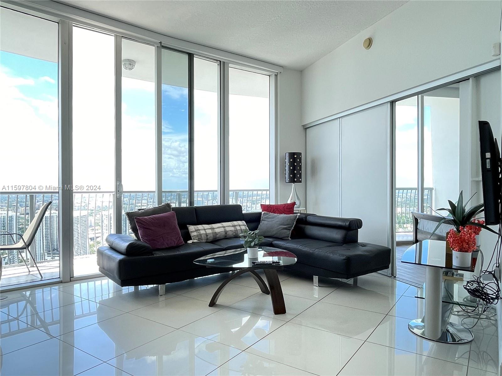 Opera Tower, airbnb-enabled penthouse in Edgewater, Miami! This stunning 2Br and 2Ba  penthouse on the 54th floor offers sophistication, comfort, and convenience. It's a great rental investment, allowing Airbnb rentals from 30 days and up. Key features include panoramic views, elegant interiors with new flooring and appliances, a private terrace, and access to hotel-like amenities. Prime location near Margaret Pace Park, supermarkets, restaurants, and more. Minutes from downtown, Wynwood, Design District, and South Beach. Flexible lease options make it an ideal investment or dream home. Don't miss out on owning a unit in Miami's most convenient location. Contact the listing agent to schedule a showing.