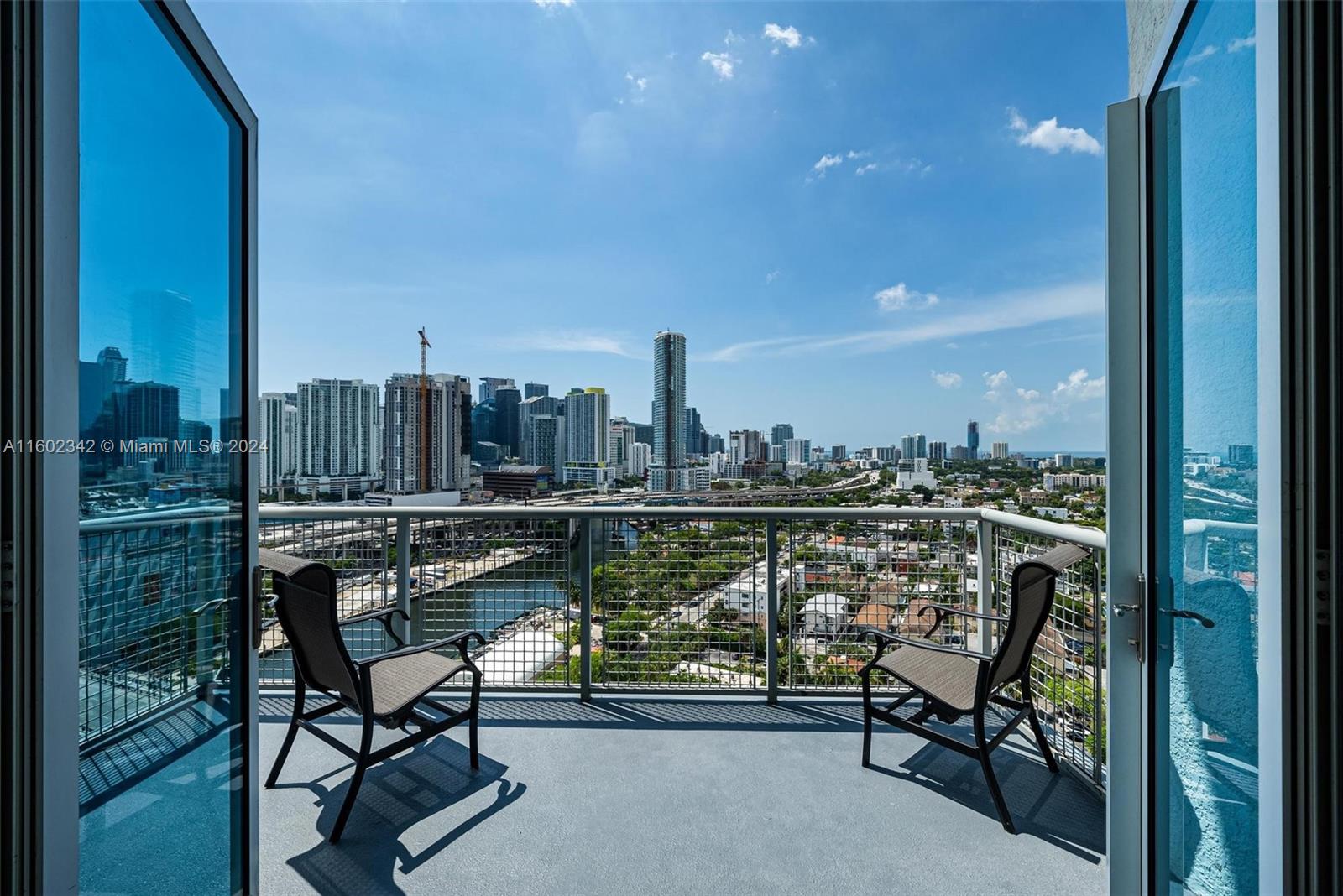 Experience breathtaking views from this large loft-style penthouse in NeoLofts. This unique 3-bedroom, 2-bathroom unit overlooks the Miami River and the new 10th St. Bridge, offering spectacular night views of yachts, boats, trains, trolleys, and the vibrant city lights. 

Four expansive windows (4' x 7') and 9-foot wide glass doors flood the space with natural light, while the kitchen boasts sweeping views of Brickell, the river, and Coconut Grove Bay. 

The two-story layout features a open kitchen, dining, living room, bedroom, and full bath on the main level. Upstairs, find two additional bedrooms, a full bath, laundry, and a wide hallway. Includes two parking spots (A–27, A–28) at level 2 + storage. Close to Brickell City Center, restaurants, banks, I-95, 10 min to Miami Airport.