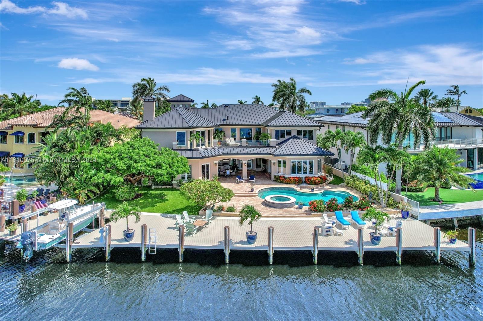 Fort Lauderdale's most desirable waterfront location offers breathtaking views from the Intracoastal Waterway to Sunrise Bay. A boater’s dream, the estate sits on a 12,651 sqft lot, enhanced by a 2,000 sqft dock with a boat lift. Situated on a quiet cul-de-sac and private isle, the property greets you with stunning water views upon entry. The spacious home features generous living areas, and the second floor boasts an expansive terrace, an oversized primary bedroom facing the bay, a large loft, and an office den. Additionally, the home includes an elevator for easy access. The first level has three bedrooms, providing ample space for family and guests. Conveniently located near Coral Ridge Yacht Club, George English Park, and pickleball courts, offering the ultimate South Florida lifestyle