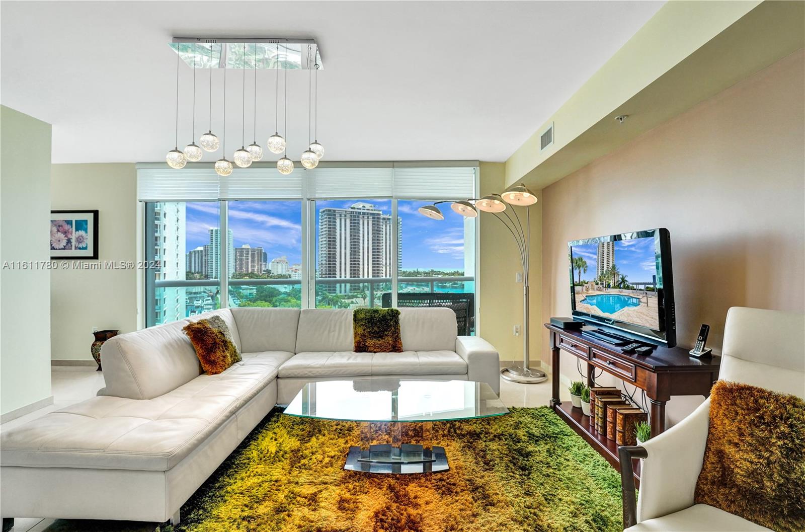 Lovely condo situated in The Parc at Turnberry in the heart of Aventura, boasting views of the Intracoastal, Ocean, and marinas. The unit offers a private elevator and foyer. Kitchen with SS appliances, wood cabinets, granite countertops, tiled backsplash and a stylish breakfast nook. Spacious 2 BD, 3 BA, in addition a versatile closed den with closet that can serve as a third bd. or office, with a full bath next to it. Primary BD features two separate balconies, primary & second BD have its own En-suite bathroom. W/D, Shabbat elevator and Impact windows. Enjoy five-star amenities - pool, kids pool, Jacuzzi, men & women's spa, massage rooms, gym, billiard & party room, business center & children's tot lot. Two pets up to 35 lbs. are welcomed conveniently located near houses of worship.