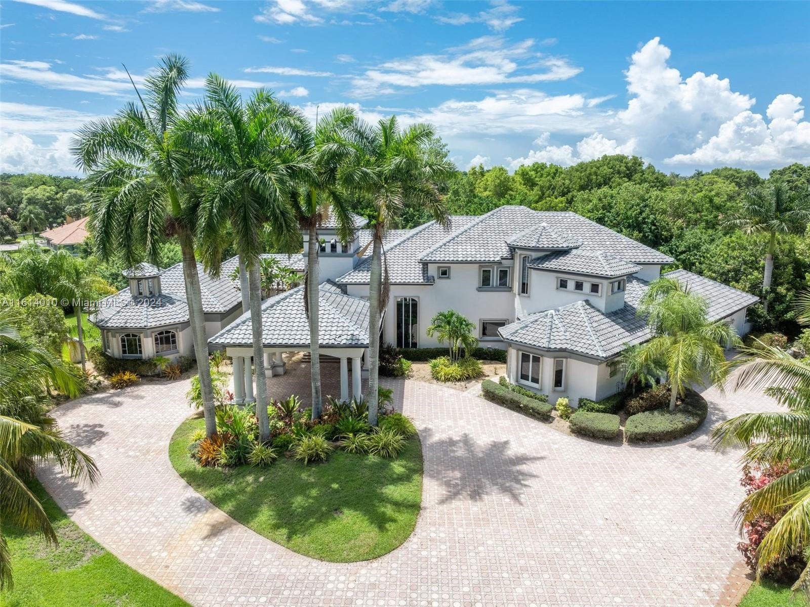 Welcome to 3079 Old Still Lane, a modern gem tucked away on a 1.53-acre cul-de-sac lot in the sought-after Windmill Ranch Estates. Sprawling paved driveway leads you to the porte-cochere entry. This spacious 7,490 sq ft home features 6 bedrooms, 6.5 bathrooms, an office, and a loft, offering plenty of room for the whole family. The open floor plan with soaring 20' ceilings sets the stage for unforgettable gatherings. Whip up culinary delights in the modern kitchen with a handy butler's pantry. Outside, you'll find a tennis court, a refreshing pool, and a sprawling backyard for endless fun. Master suite on 1st floor. New roof & gutters. Accordian shutters throughout. Lowest price per square foot home in the community.