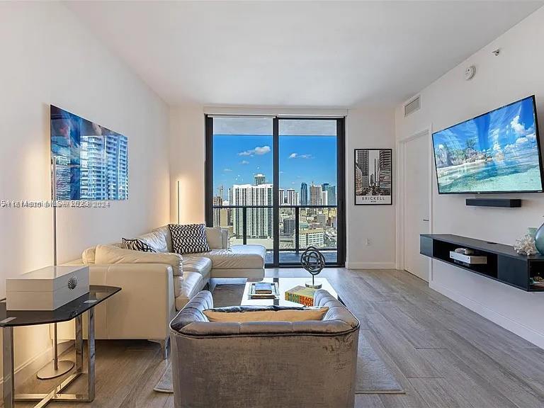 Discover a stunning modern condo in the heart of Brickell, Miami. This luxurious 1-bedroom, 1.5-bath unit offers breathtaking river and skyline views, making it a prime investment. Currently rented at $3,550/month with expenses of $1,713/month (covering tax and HOA), it offers solid returns. The tenant’s lease runs until April 2025, but if the buyer is an end user, the tenant is open to moving once sold. Features include premium appliances, an Italian kitchen, custom cabinets, floor-to-ceiling impact windows, and a spacious balcony. Located in a 5-star building with top amenities, just steps from Brickell's best