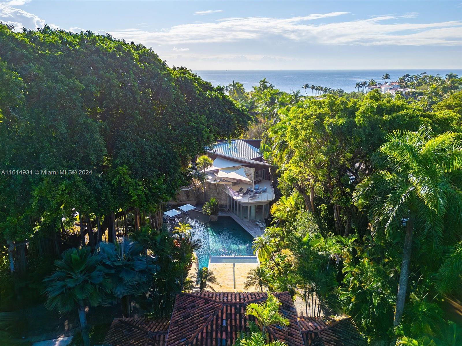 Once-in-a-Lifetime Opportunity. Introducing Banyan Ridge Estate in the heart of Coconut Grove. This mesmerizing multi-acre private gated haven tailored over 4.5 decades never before offered to the public. 2 parcels feature direct ocean views boasting 180’ of water-frontage. Banyan Ridge transports you to a transcendent oasis w/ meticulously landscaped grounds. 100-year-old Banyan Tree anchors the estate, flanked by cascading waterfalls, tropical saltwater fishpond, lap infinity pool, terraces overlooking the bay & the finest blend of amenities reminiscent of the most elite world-class resorts. Escape to the tranquility of meditation gardens as every corner of this property is an architectural masterpiece waiting to be experienced. Estate is being sold together with 7 additional parcels.