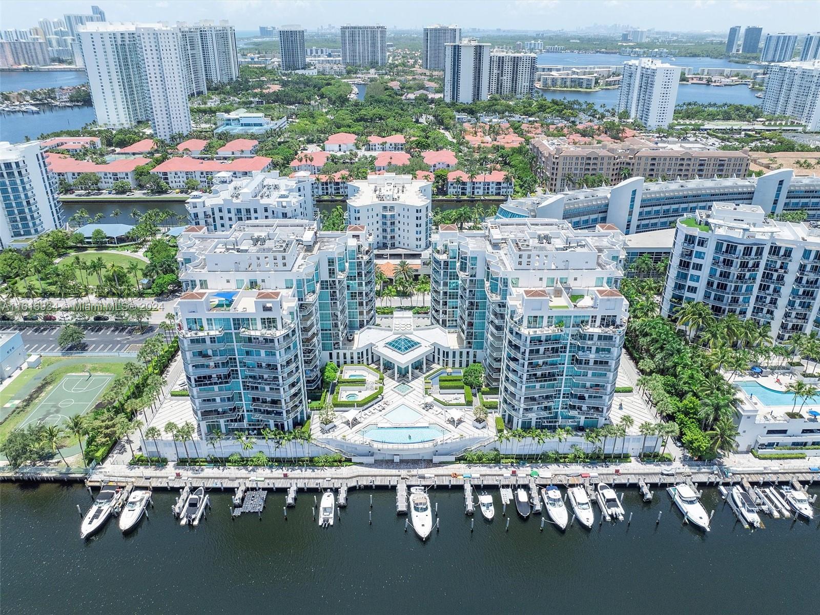 Discover luxury living in this expansive 2 bed, 2.5 bath waterfront condo in Aventura. Boasting 1590 Sq Ft of refined elegance, this home features marble floors throughout. Enjoy stunning views from spacious terraces overlooking the pool and waterfront. Floor-to-ceiling windows illuminate the ample living space and formal dining area under tall ceilings. The primary bath offers a jacuzzi bathtub, separate shower, and dual sinks. The unit offers 2 assigned parking spaces and extra storage. Amenities include a 24-hour concierge in the lobby, a well-equipped gym, and a refreshing pool. Experience the epitome of modern comfort and convenience in this prestigious community.