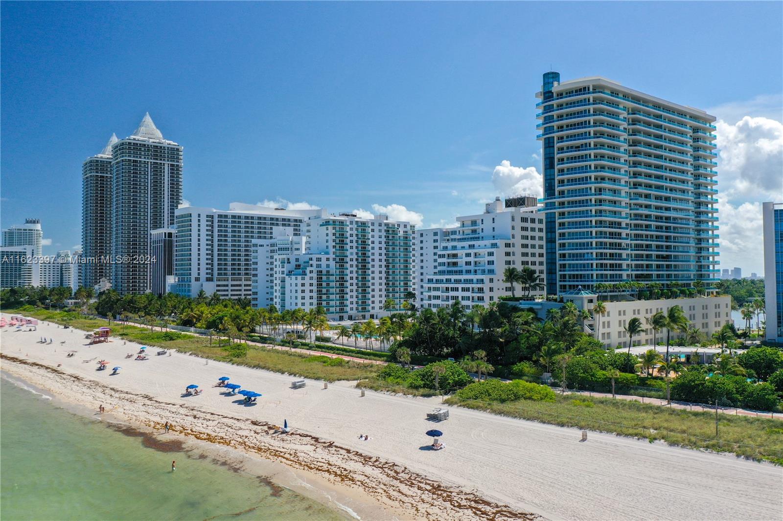 This spectacular oceanfront residence offers a breathtaking wrap-around glass balcony with panoramic ocean and intracoastal views. The updated unit features a spacious layout with 3 bedrooms, 3 bathrooms, and elegant furnishings. The split floor plan provides privacy, while the remodeled kitchen boasts top-of-the-line appliances. The master bedroom and living area offer stunning ocean vistas. Residents enjoy 24-hour security, valet parking, concierge services, beach service, an exercise room, pool, jacuzzi, and direct ocean access with a private beach. The prime location is just minutes from South Beach and Bal Harbour, adjacent to Soho House and Faena.