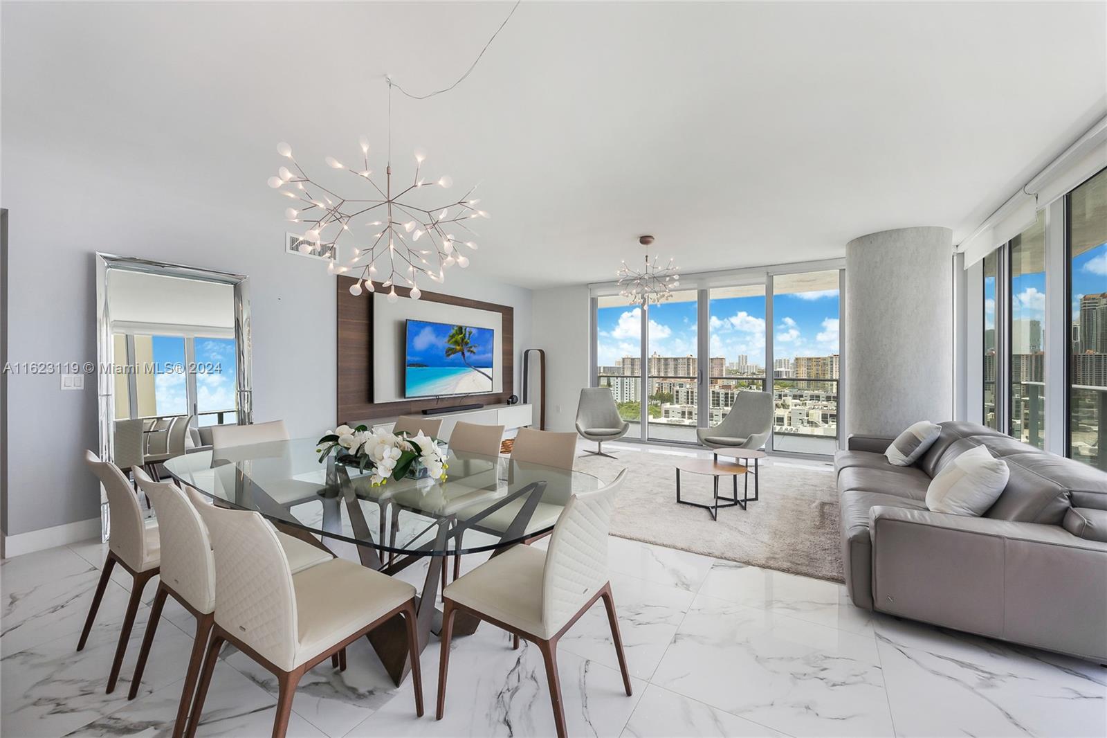 Located in beautiful Sunny Isles Beach, this turnkey furnished corner unit is within walking distance to the beach, restaurants, and bars. The expansive 1,892 sq. ft. home features 10ft ceilings, floor-to-ceiling impact glass windows and doors, and a wrap-around terrace with stunning panoramic views. It offers high-end European appliances, window treatments, and light fixtures throughout. The primary suite includes a walk-in closet and a luxurious bath. Amenities: beach service, 4 pools, jacuzzi, gym, spa, kids club, theater, games room, bistro, party room, and guest suite. Includes storage, 2 parking spaces, and valet. Enjoy serene water views and the vibrant Sunny Isles Beach lifestyle. Schedule a viewing today!