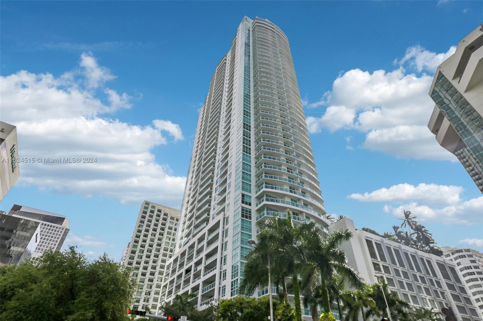 Improved pricing! Beautiful corner 2 bedroom, 2.5 bathroom unit in the fully amenitized Plaza on Brickell. This coveted 10-line features a split bedroom layout, with two ensuite bedrooms on opposite sides, allowing for spacious living areas and significant natural light. Both bedrooms have walk-in closets, showers, and bathtubs. The generous living area accommodates a dining table, living room, and kitchen counter barstools. The open-concept kitchen boasts top-of-the-line stainless steel appliances and looks out into the living area. Brand new laminate wood flooring adds elegance and warmth throughout. The corner unit allows for a large balcony with city and bay views. Brickell Plaza offers comprehensive amenities, including 24/7 security. The unit includes two dedicated parking spots.