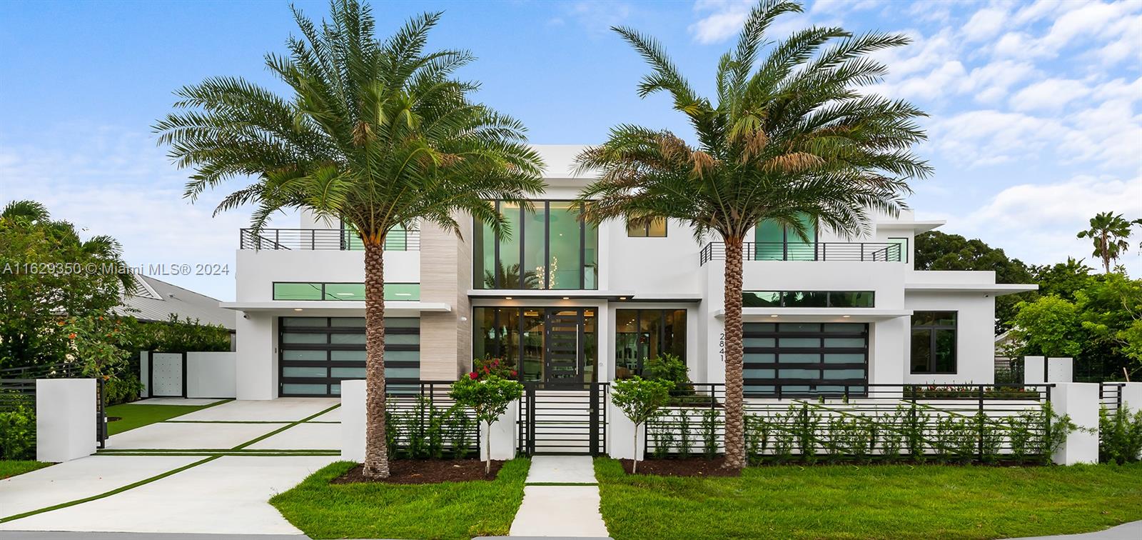 An exquisite home on Coral Ridge Estates' widest canal with 125 feet of prime waterfront, one lot from the Intracoastal waterway. This architectural marvel boasts spectacular views of the canal and Intracoastal, soaring ceilings, two primary suites, an elevator, dual 2-car garages, an open, seamlessly flowing floor plan. Impeccably designed, the luminous interior with custom touches includes a majestic great room with a bar, a gourmet chef's kitchen with a glass-enclosed wine cellar, double-sided fireplace, and outside, the allure continues with expansive covered areas, pool and hot tub, deluxe summer kitchen, and a private concrete dock with new seawall. This waterfront estate, located across from the prestigious Coral Ridge Country Club, is an unparalleled testament to luxury living.