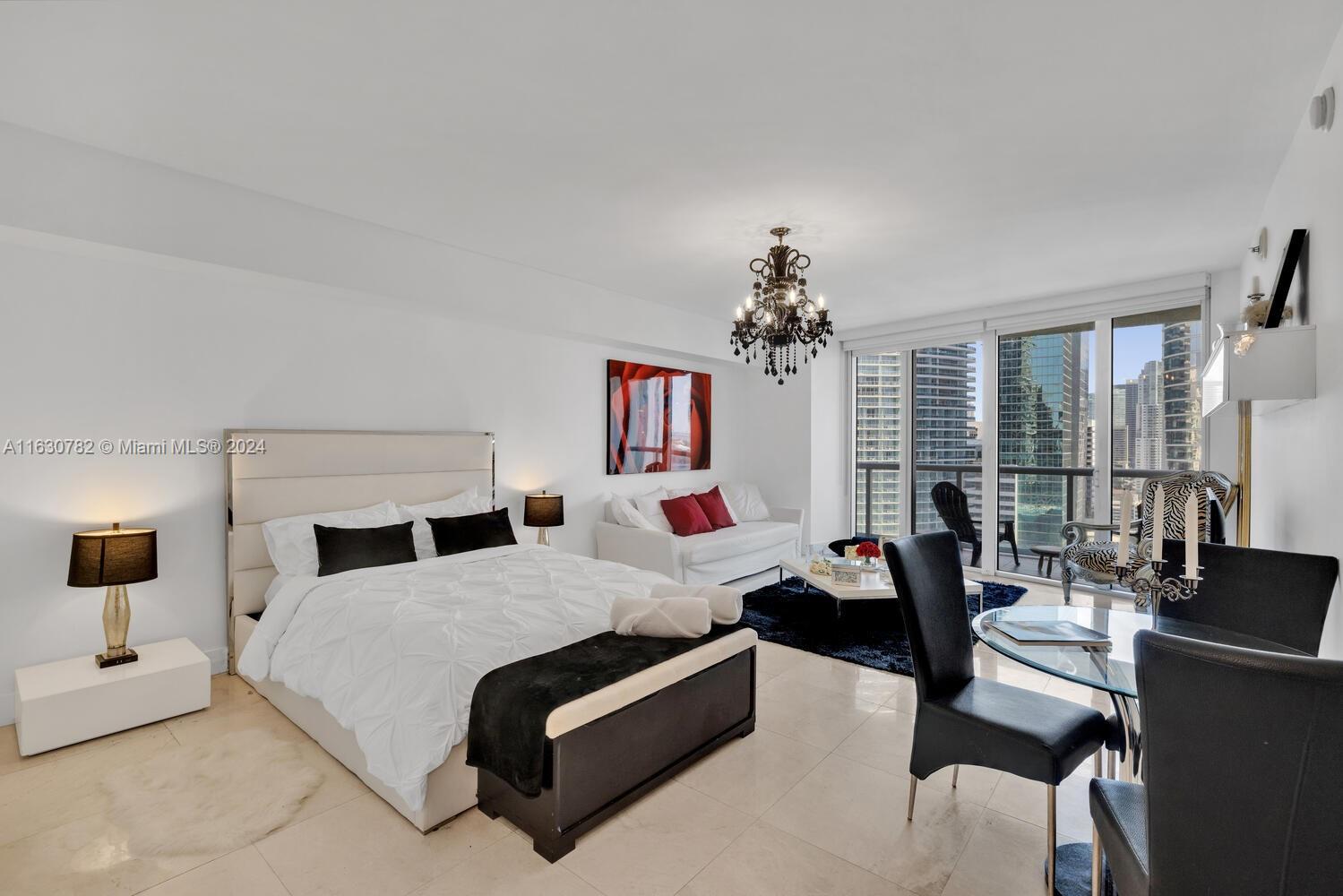 Beautifully furnished studio overlooking Miami River and Downtown Miami. Unit features marble floors that carry on to the balcony, high end appliances, Subzero refrigerator and Wolf cooktop. 1 assigned parking space. Best studio line in iconbrickell tower one.  Iconbrickell offers an olympic size pool, hot tub, spa and gym.