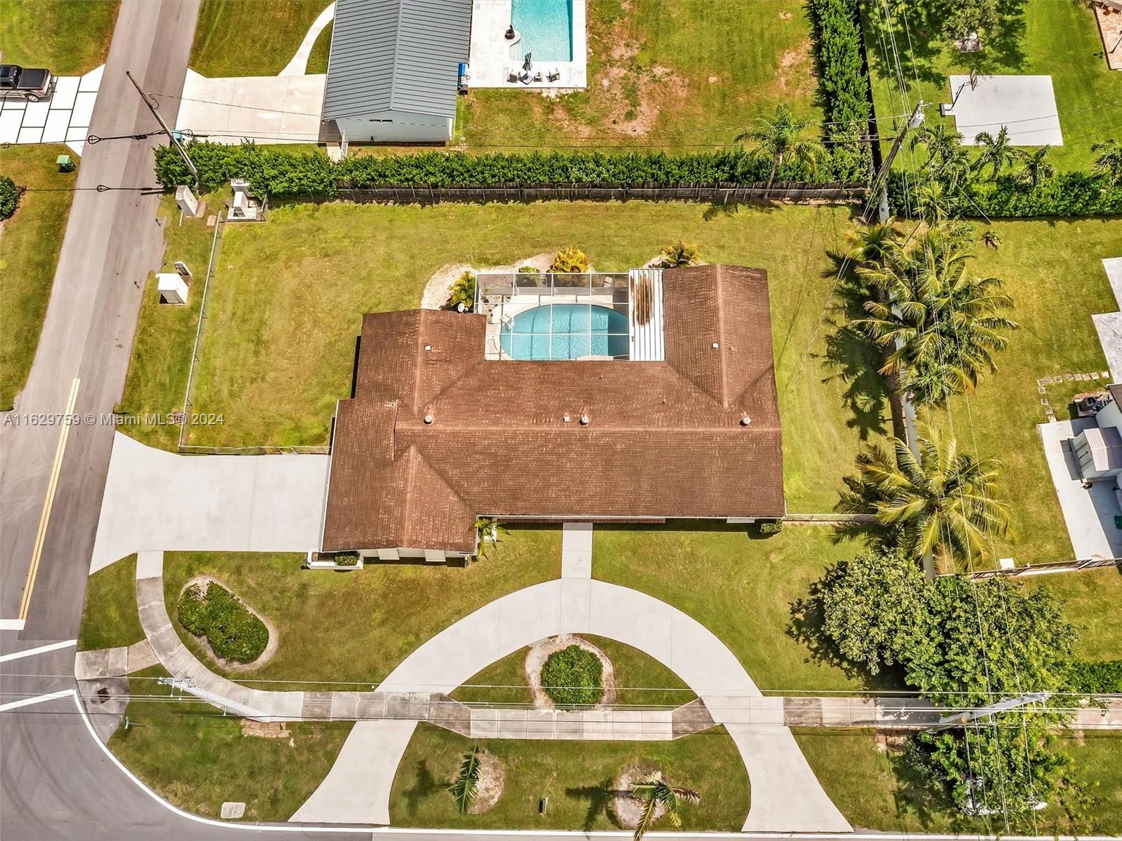 This four-bedroom, three-bathroom home offers an exciting opportunity for those seeking more space. Situated between Dadeland Mall and The Falls Mall, the property boasts a spacious 15,301 square foot corner lot, two-car garage, and screened-in pool. Apartment dwellers and growing families, you are encouraged to transform this house into your dream home. With its attractive features and prime location, this property promises the perfect blend of space, potential, and possibility for prospective homeowners looking to make their mark.