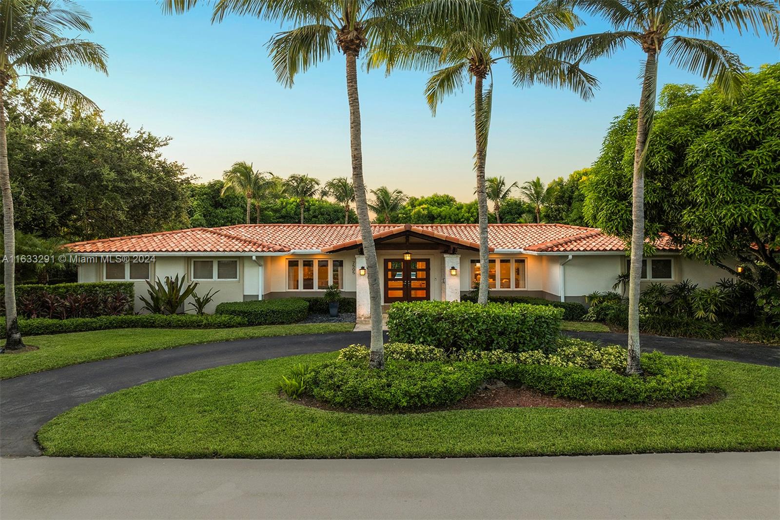 Elevated elegance meets fabulous function in this expansive home, perfect for living and entertaining. Designed in the California Bungalow style by architect Hamed Rodriguez, the grand entry reveals a contemporary yet inviting interior. Solid wood floors flow throughout the open layout, offering over 4,000 Sq.Ft. of living space, a home gym, integrated workspaces, and a breakfast room with a built-in banquette. The giant kitchen features a Wolf gas range and Subzero refrigerator, anchored by sleek quartz countertops. Impact French doors open to a 900-Sq.Ft. covered patio for lounging, dining, and grilling at the outdoor kitchen. Retreat to the primary bedroom with its large sitting area and direct access to the oversized pool, deck, and beautifully landscaped yard.