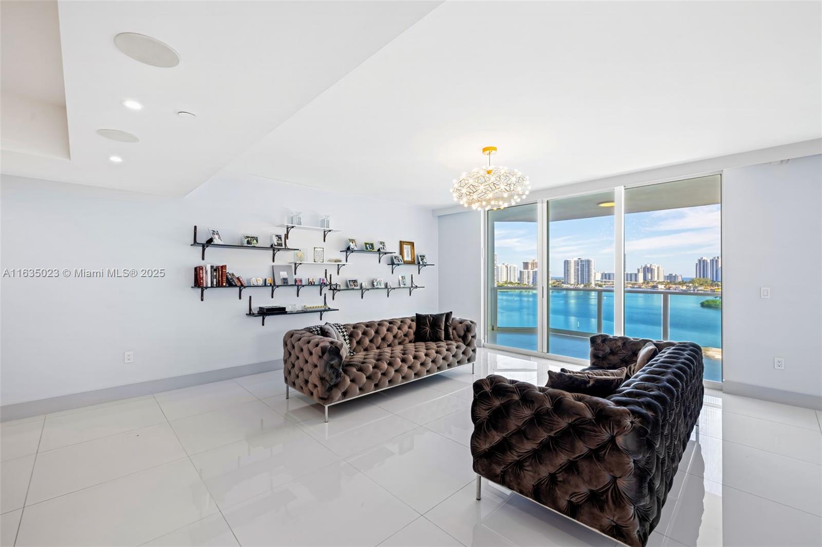 This exceptional unit at Peninsula II features 3 bedrooms plus a den, 3 and a half bathrooms, and a large master bedroom. The kitchen is spacious, adorned with white crystal flooring. Enjoy beautiful views of the city and intercoastal from this unit. While it is unfurnished.