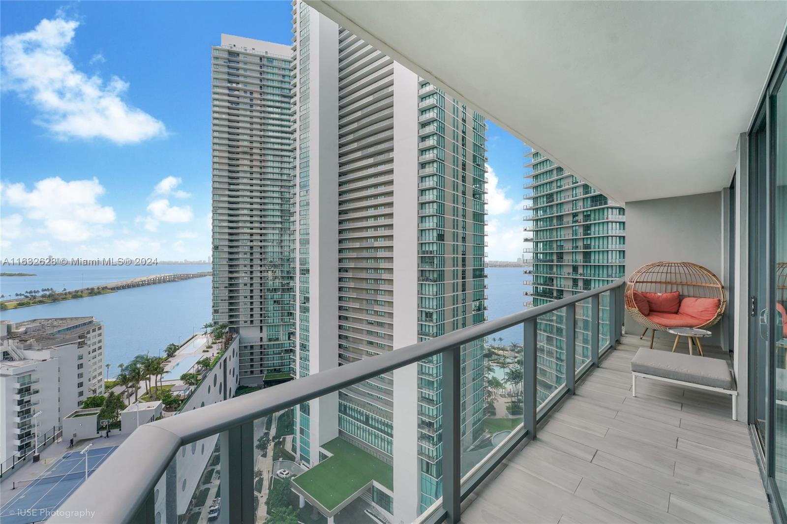 This stunning 3-bedroom, 2-bath apartment in Miami offers water and city views from every room. The unit includes a versatile den and a spacious kitchen with newly added cabinets and flooring, boasting a clean, modern aesthetic. Enjoy the outdoors from the large wraparound balcony with expansive views. The primary bedroom features serene water views and a luxurious bathroom with dual sinks, a bathtub, and a shower. The building's top-notch amenities include a gorgeous rooftop pool with breathtaking 360-degree views of the entire city, perfect for relaxation and unwinding.