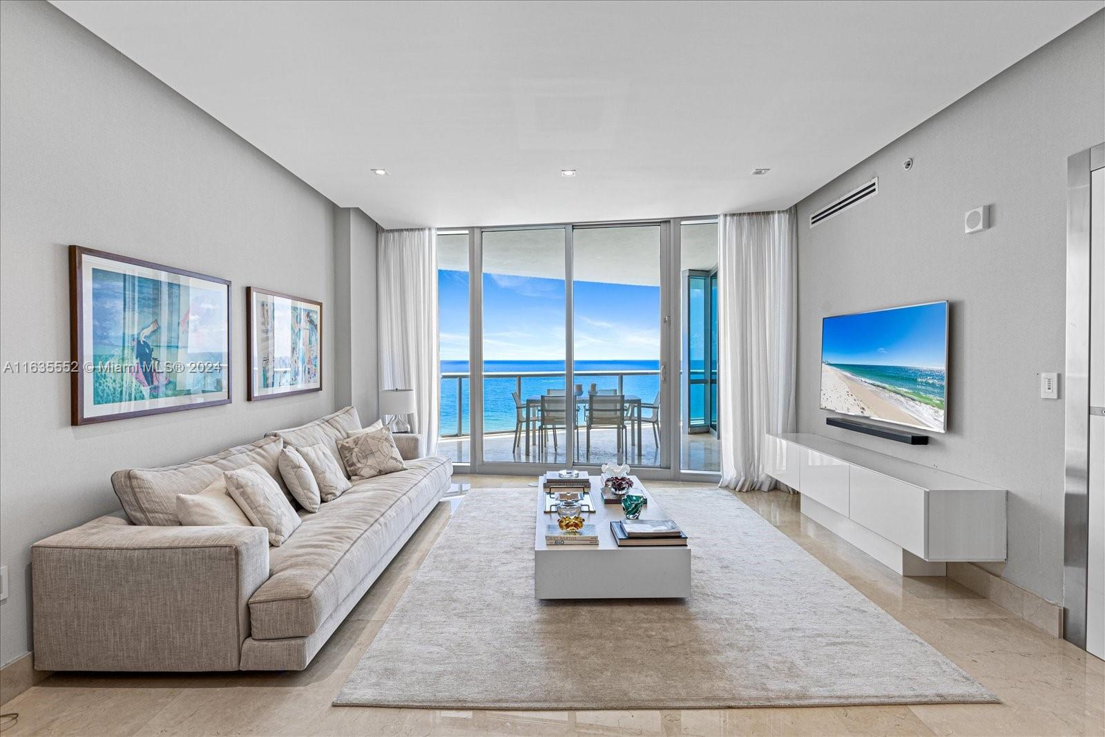 Welcome to Amazing ocean views and breathtaking Sunsets in this Flow through 3Bed/3.5 bath unit at Jade Ocean. Tastefully finished, top of the line appliances, Gourmet Kitchen, electric blackouts and elegant curtains in living and master room. The residences at Jade Ocean feature European Snaidero cabinetry, Miele and Sub-Zero kitchen appliances, private elevators. Designed by award-winning architect Carlos Ott, residents enjoying a number of five-star amenities, including a state-of-the-art health club, a children’s playroom, a theater, a business center, infinity-edge pools, a spa, treatment rooms, a sauna, full-service concierge, a private beach club, a children’s splash deck. The beds and dining table set will be replaced. The paintings above the sofa are not included.