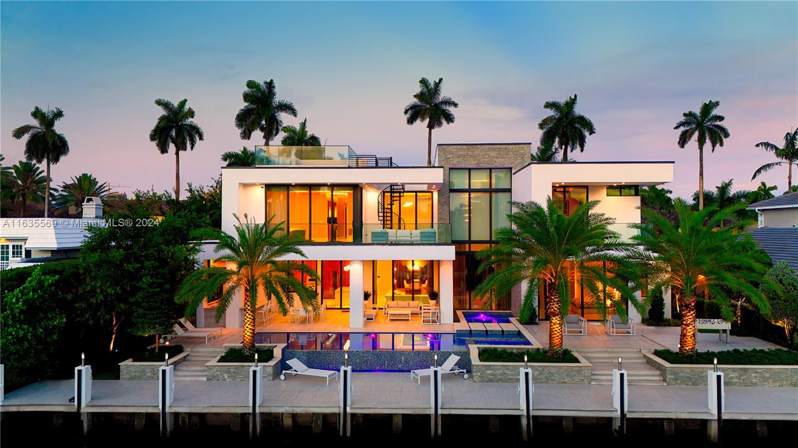 This contemporary masterpiece in prestigious Las Olas Isles was meticulously designed by Michael Gray in 2023. This stunning home boasts 7 beds, 7 full baths, and 2 guest baths on a 11,000 square foot lot with 100 feet of water frontage. The 30 foot ceilings create an elegant airy, light-filled ambiance. The state-of-the-art Italian kitchen complete with Sub-Zero appliances, 2,000 square foot outdoor space with summer kitchen, 40 foot infinity pool and hot tub cater to avid entertainers. This home also features an elevator and a common media/recreation room leading out to the rooftop. This residence offers a 3-car garage with height for lifts and ample parking in the driveway. Las Olas Boulevard, the beach, and vibrant nightlife offer the epitome in luxury living.