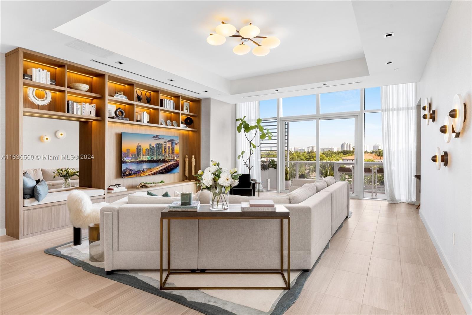 Experience the art of home at Residence 304. This stunning unit offers direct, expansive views of Surprise Lake, creating a serene backdrop. Residence 304 boasts 2,700+ SF of interior space & 298 SF terrace. 2 BR + den & 2.5 BA. 12 FT ceilings & floor-to-ceiling windows flood the interior w/ natural light, showcasing breathtaking views. The open floorplan connects living & dining areas seamlessly, perfect for entertaining or relaxation. The Boffi chef's kitchen features a gas cooktop, marble backsplash, white gloss cabinets, Gaggenau appliances, & Zucchetti fixtures. The living area includes large wood built-in cabinet & a built-in desk nook. The Owner’s suite is spacious w/ ample closet space, & the spa-like bathroom offers a double vanity, glass-enclosed shower & oversized soaking tub.