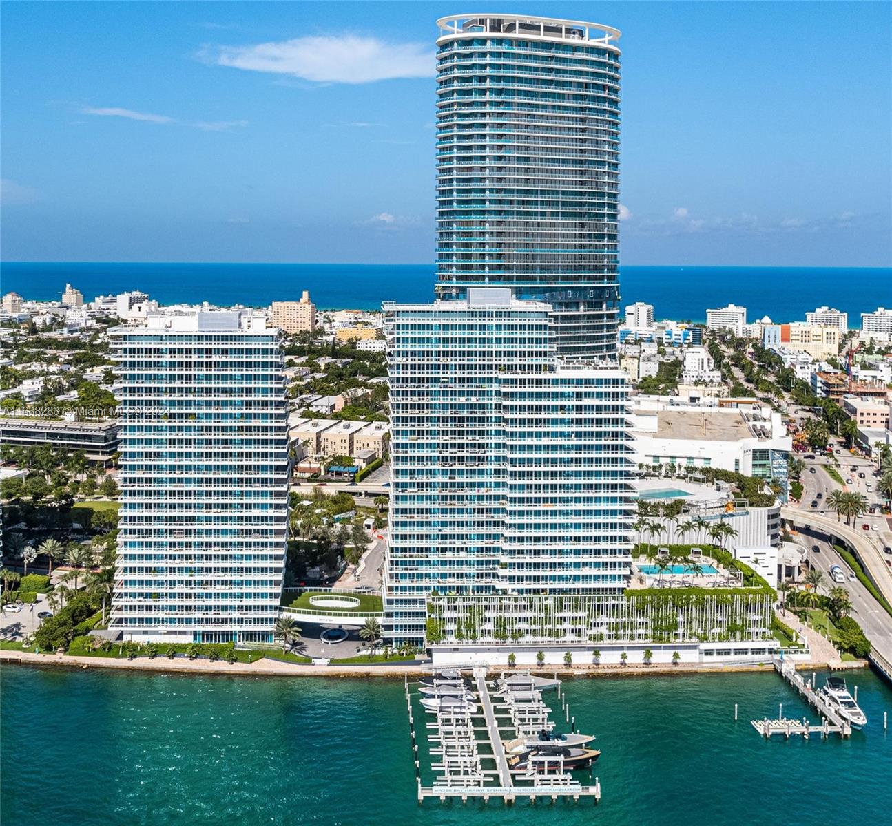 Experience luxury living in this 2-bed, 2-bath corner unit at The Bentley Bay Condo in Miami Beach. Spanning 1,058 sq. ft., this exquisite condo offers a wrap-around balcony with breathtaking views of the bay, ocean, and majestic cruise ships sailing by. The unit features a spacious open-concept design, flooded with natural light through floor-to-ceiling windows that perfectly frame the breathtaking scenery. As a resident of Bentley Bay, you will enjoy exclusive access to world-class amenities, including 24-hour security, valet parking,  pool with a lushly landscaped deck, two jacuzzis, a sauna, and a fitness center. Ideally situated, this location offers easy access to major roadways, shopping, dining, public parks, and convenient public transportation.