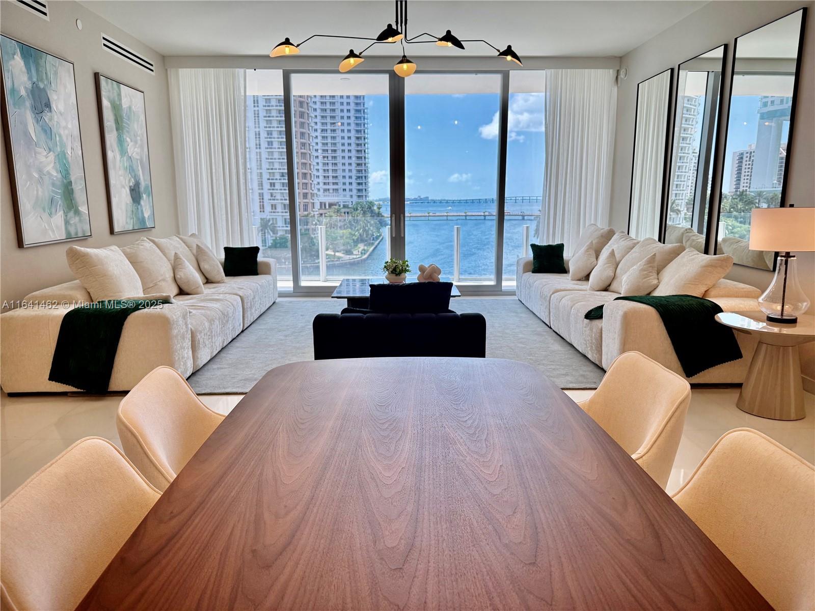 Largest Split Floor plan, Fully Furnished 2 bedrooms + DEN, 3 full bathrooms condo at Aston Martin Residences with direct Miami River views. Located on the 5th floor, this 1675 sq ft unit boasts one of the largest living rooms available for 2 bedrroms type. Motorized shares and sensor montion in closet lighting. Exclusive floor plan, with limited residences like this one. This residence includes 1 assigned parking space on same floor and top-tier finishes throughout. The building offers over 42,000 sq ft of world-class amenities, including a swimming pool on the 55th floor, a state of the art gym, spa, art gallery, 2 Movie theathers, golf practice area, grand community room, Kids room, Aston Martin DBX house Car, valet pkg, and concierge services.