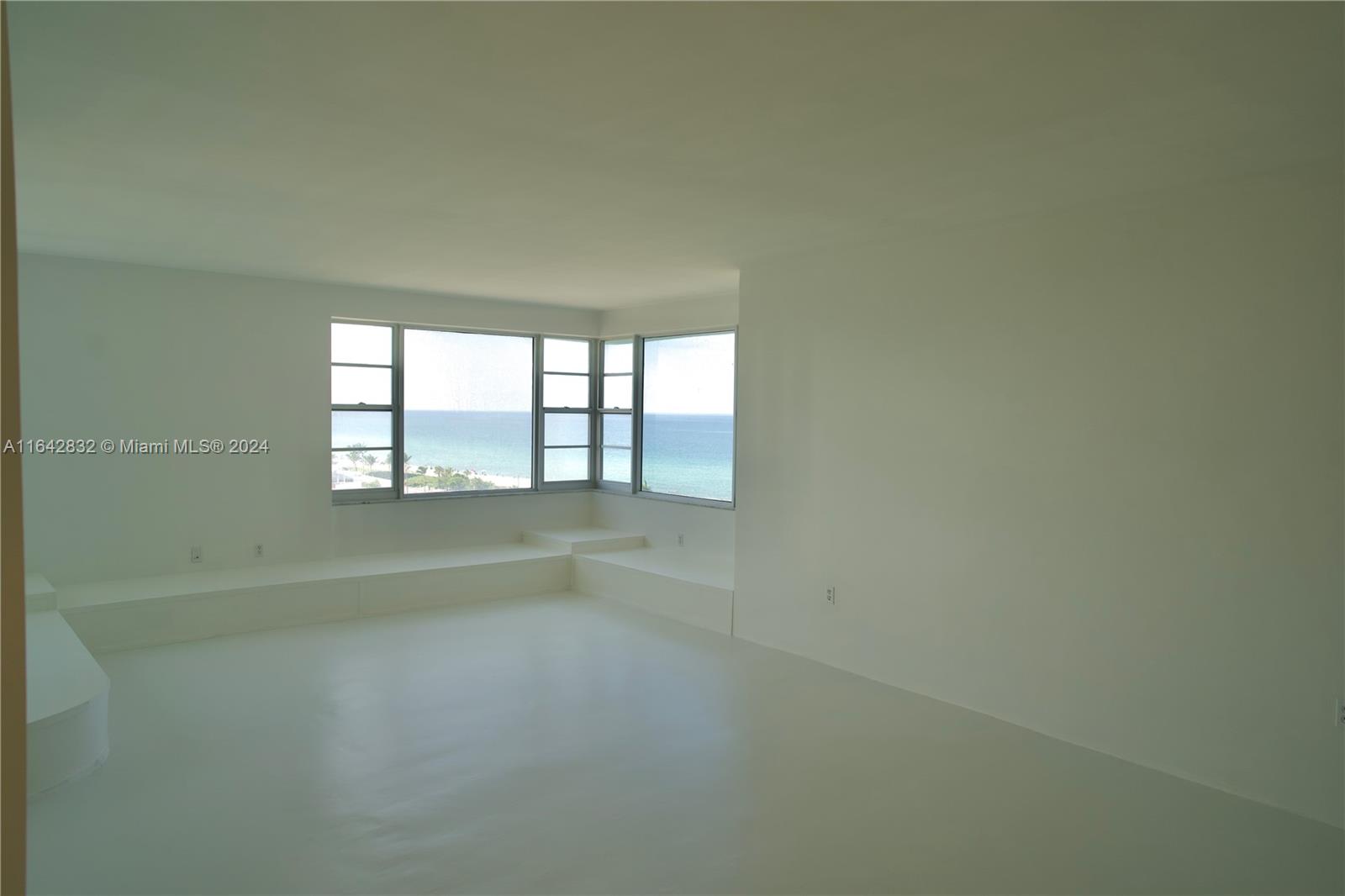 This spacious 2 bed 2 bath oceanfront condo has direct access to the board walk and beach. It's location makes it a short commute to any part of Miami. Cable and electricity is included. Sunlight soaks the white interior walls and classic Miami-pink appliances decorate both bathrooms. The first floor hosts a gym with a large assortment of equipment, as well as a banquet room for hosting events. A covered parking spot is included; a valet is available as well as a public parking area directly next door, perfect for hosting guests. The kitchen features a secondary entrance door, electric range, dual ovens, microwave, dishwasher, and has washing machines available on the same floor. Main and service elevator access. Building undergoing exterior renovations on building and pool during the day.